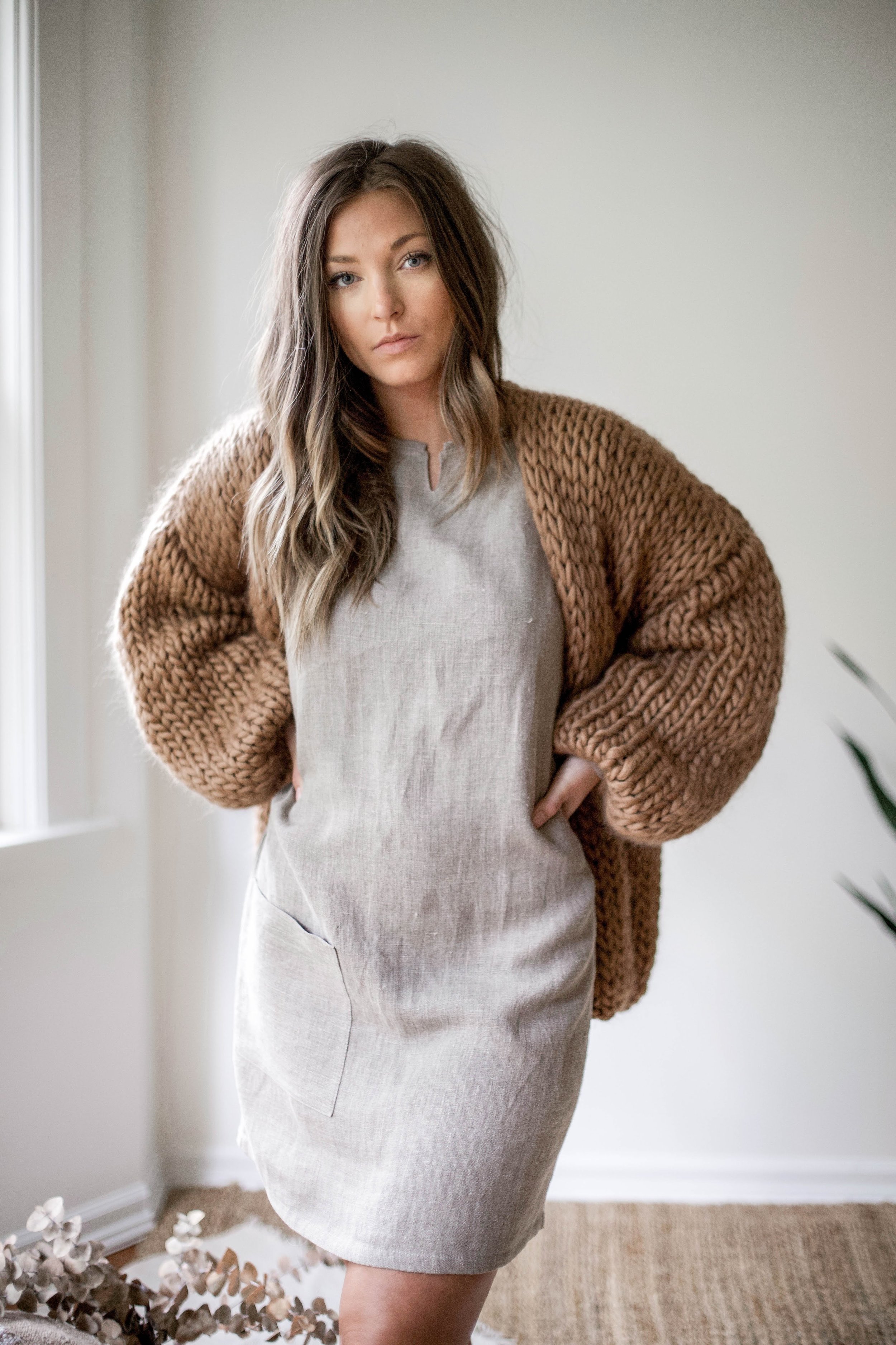 nomi-designs_ali-dress_natural-linen-dress-with-pockets_front_styled-with-oversized-hendik-lou-sweater-details.jpg