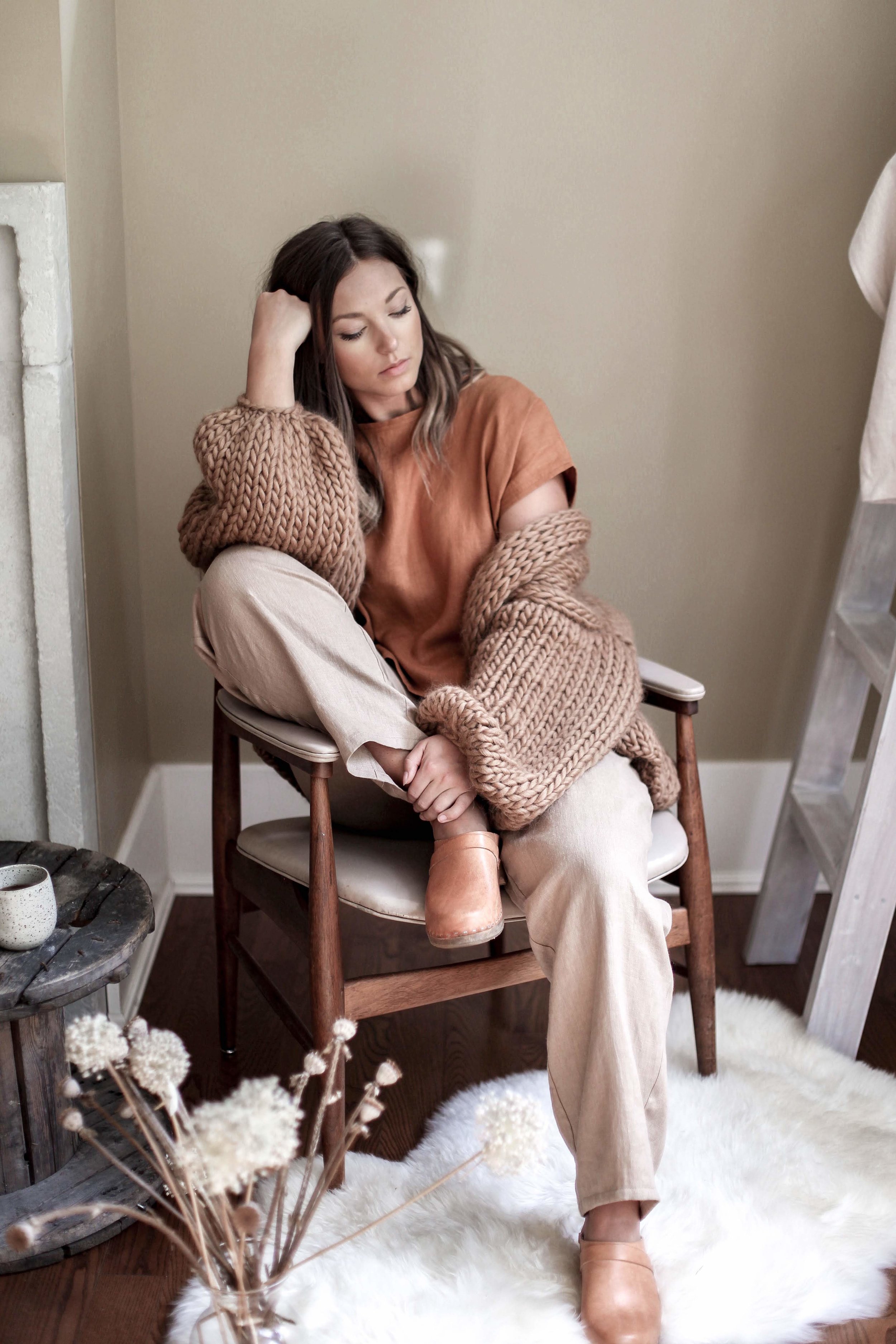 nomi-designs_jessie-top_rust-colored-natural-linen-short-sleeve-top_front_with-lyndsey-pants_styled-with-hendrik-lou-sweater.jpg