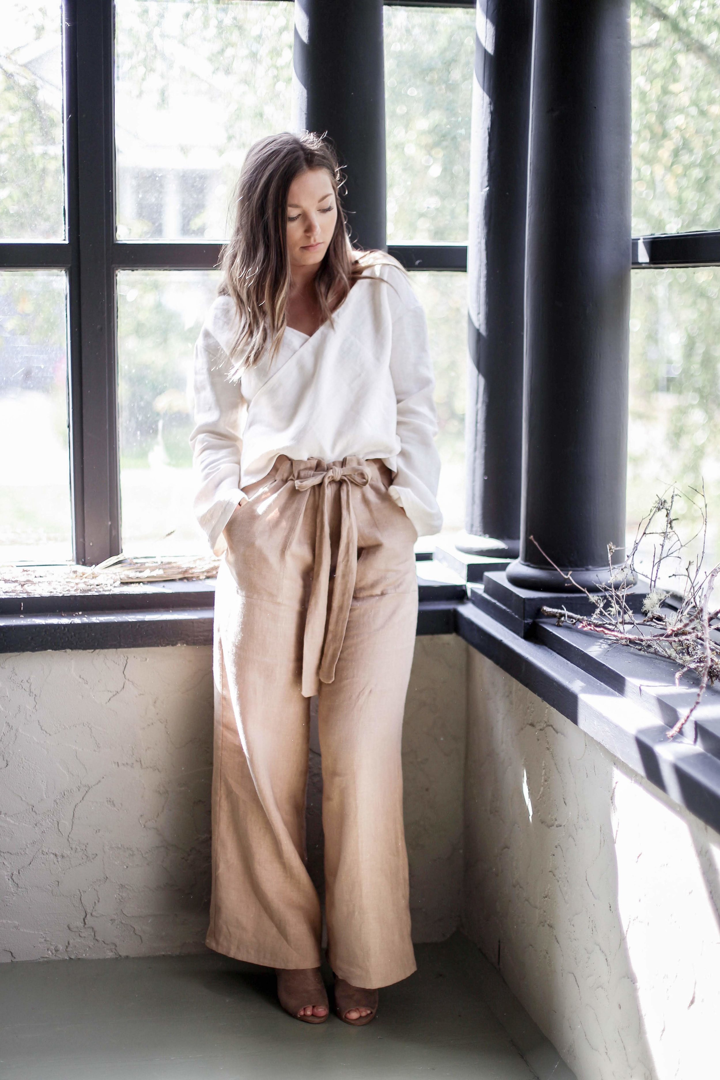 nomi-designs_maya-pants_camel-colored_natural-linen-pants-with-pockets-and-tie_styled-with-white-linen-top.jpg