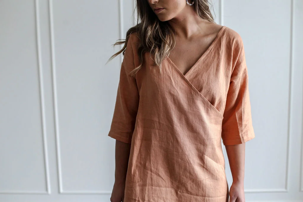 Handmade natural linen clothing by Nomi Designs in Victoria, BC | peach linen 3/4 sleeve mid length dress tunic - front