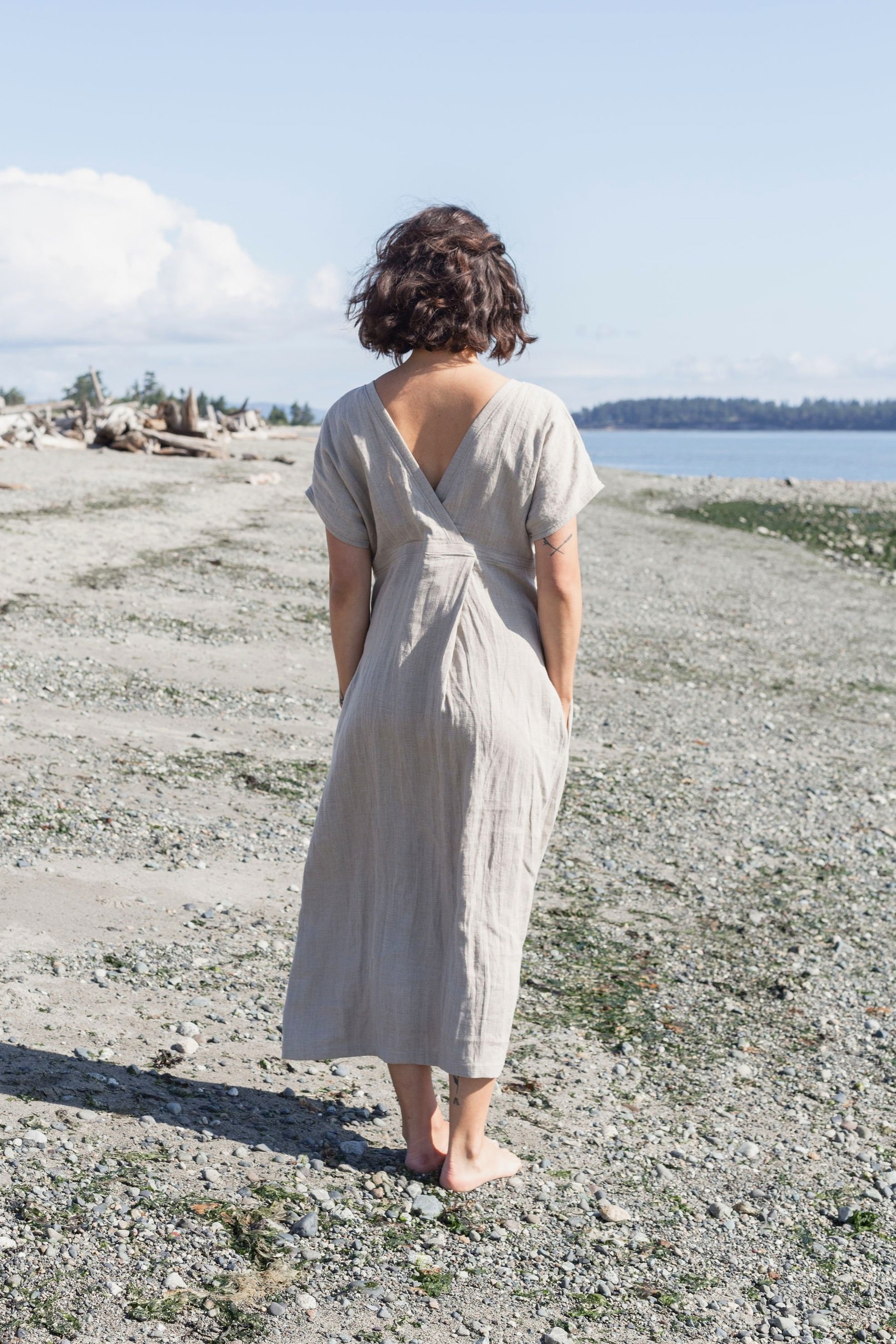 Woman wearing natural short sleeve linen maxi dress