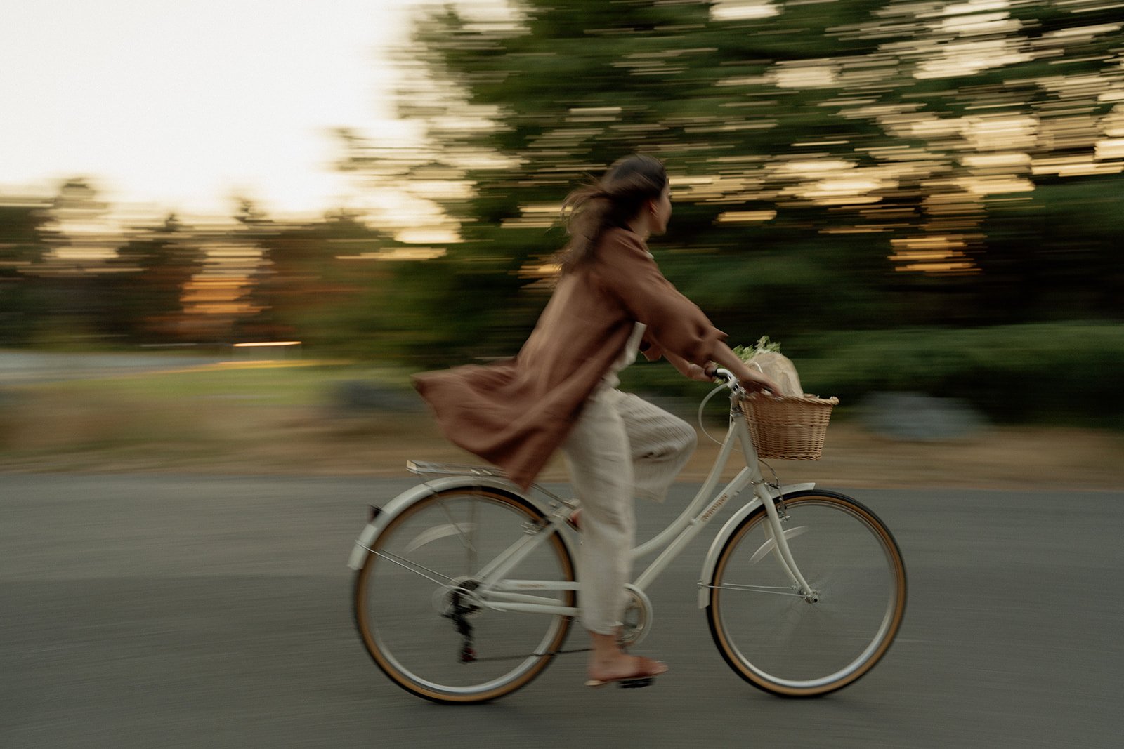 linen-coat-caramel-pants-pottery-riding-bik.jpg