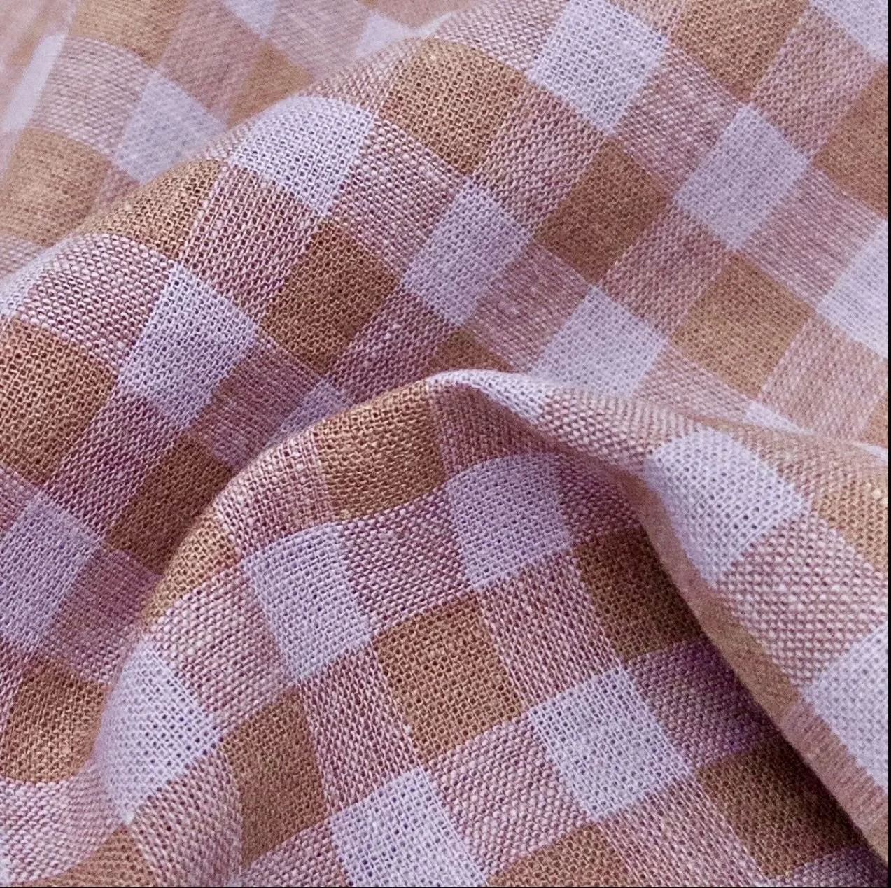 New fabric is arriving this week, and I&rsquo;m looking for the perfect name. I&rsquo;d love to hear your ideas.
The tones are lilac and cocoa in a check.