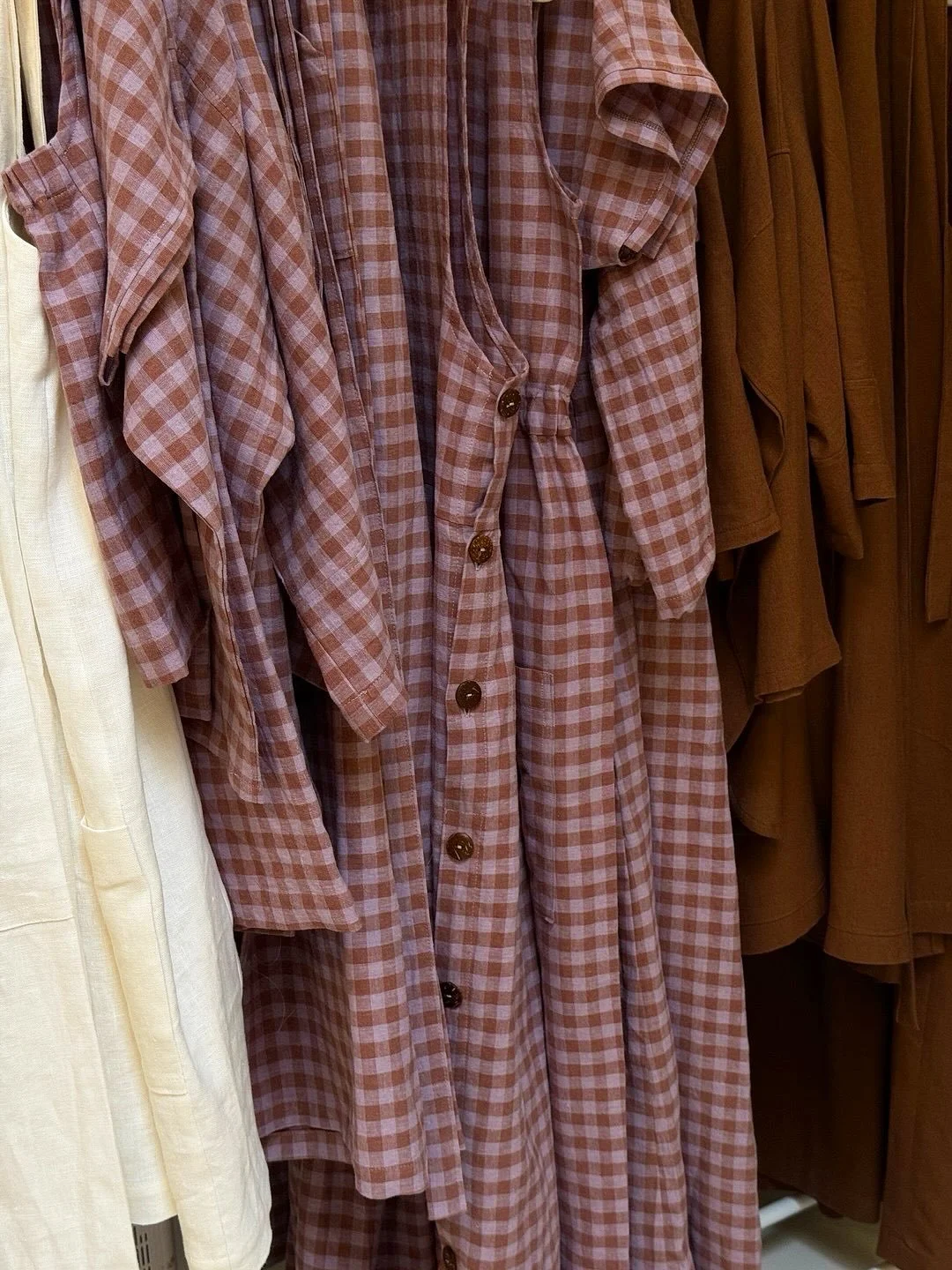 The Lilac/Cocoa Check pieces are ready for a shoot.
The fabric is soft with a light texture, so it feels gentle on the skin. It&rsquo;s breathable and easy to wear every day. 
See how the check colour pairs beautifully with the Cocoa pieces and other