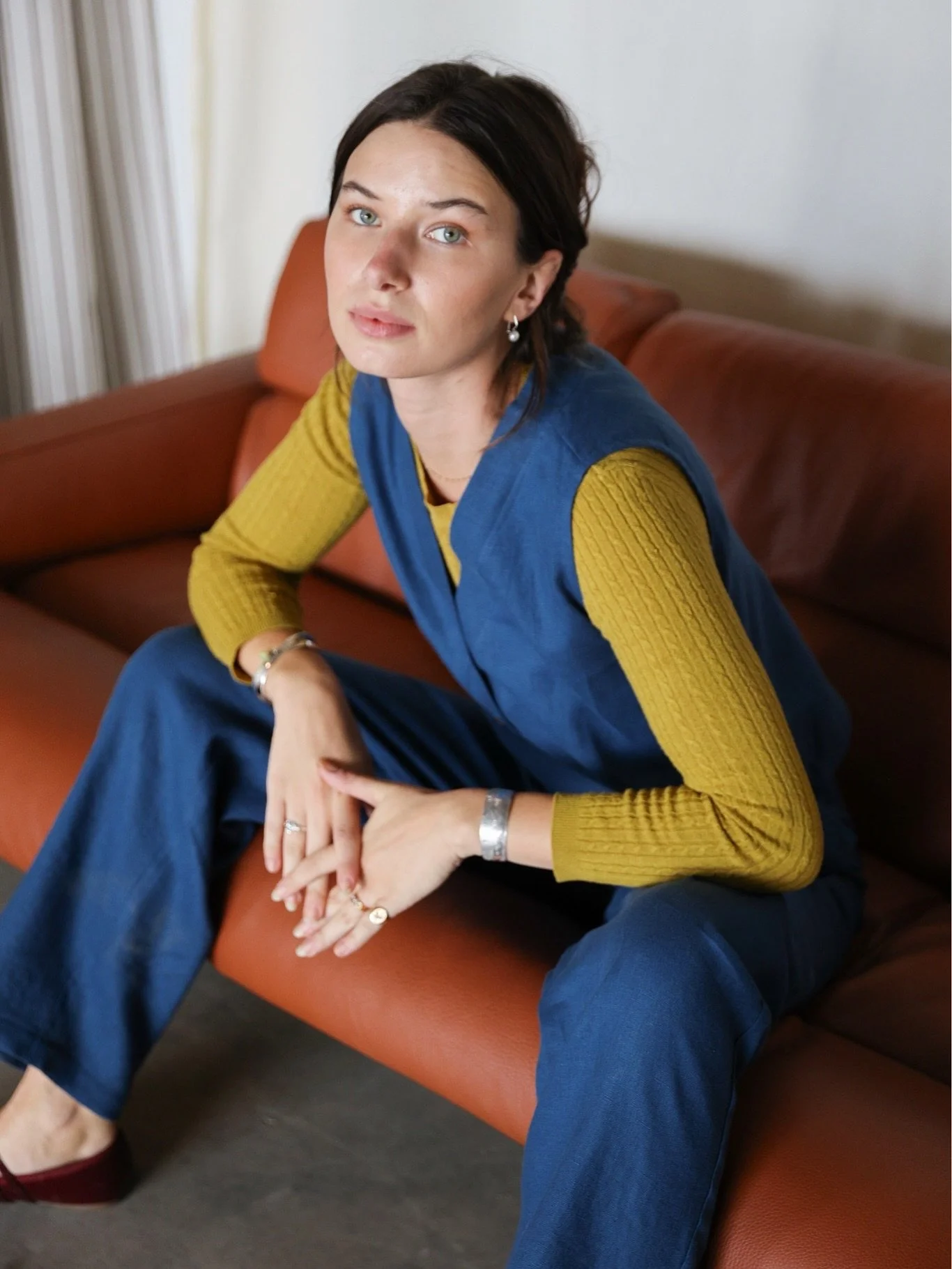 In this outfit, the colours work so well together, and it&rsquo;s such an easy way to transition linen into fall.

I love pairing linen pieces with a sweater. The Nomi Vest and Lyndsey Pants in Ocean look so nice with a mustard sweater underneath. Ju