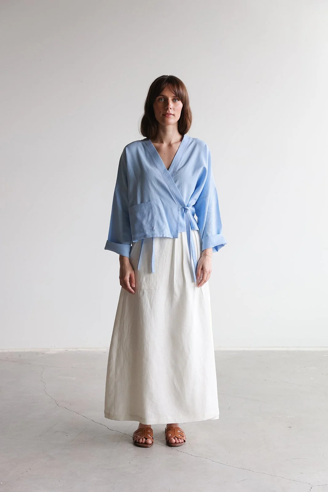 nomi-designs-linen-wrap-skirt-ivory-top-sky-front.jpg