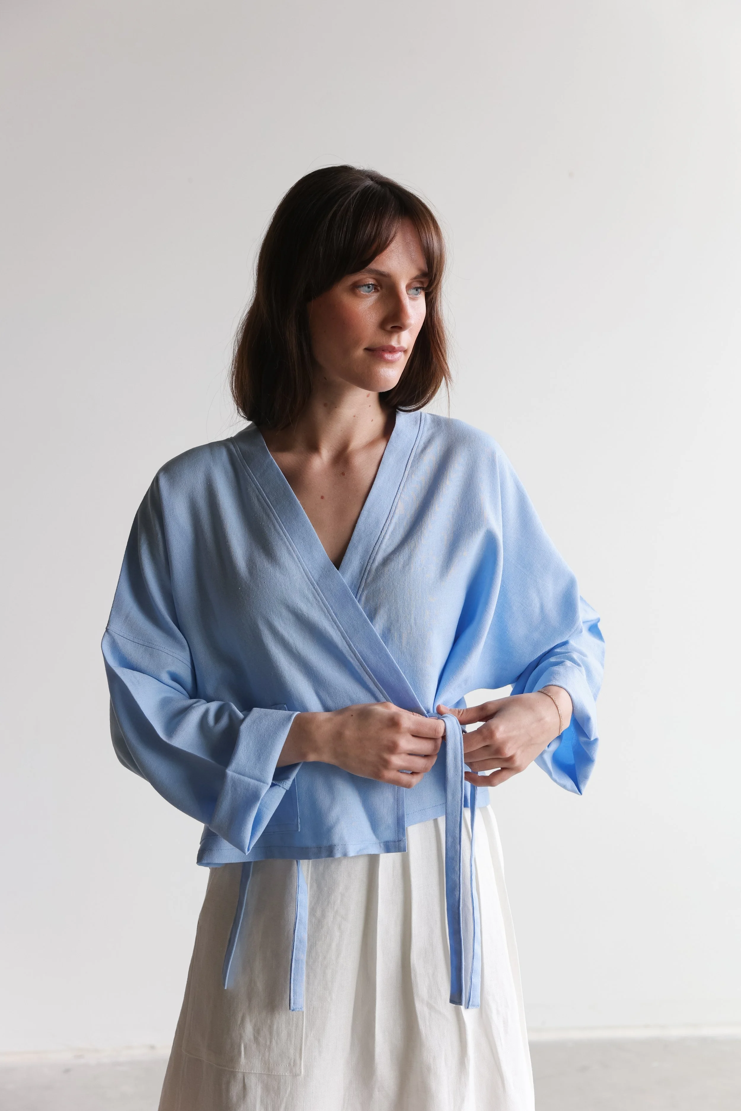 nomi-designs-linen-wrap-top-sky-details-straps.jpg