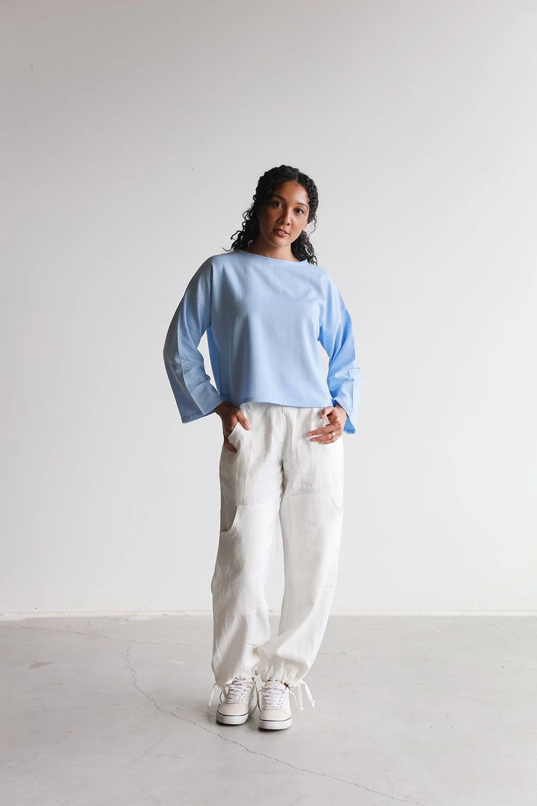 nomi-designs0linen-pants-ivory-long-sleeve-top-sky-front.jpg