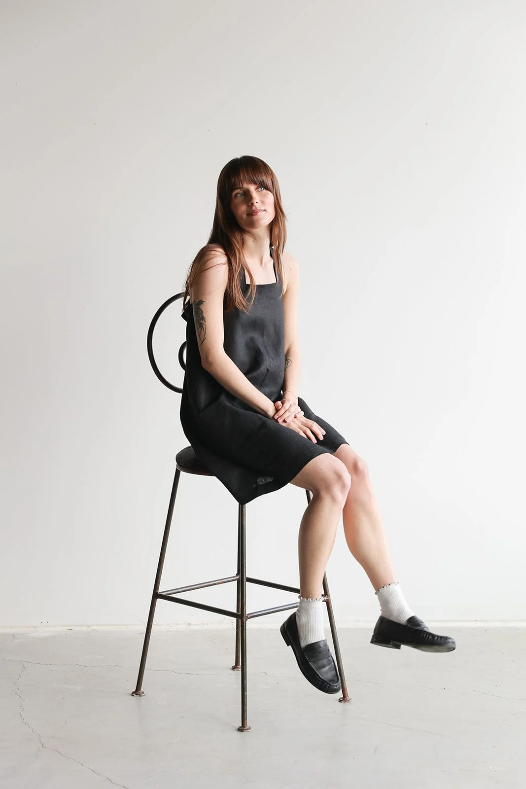 nomi-designs-linen-straps-dress-black-sitting.jpg
