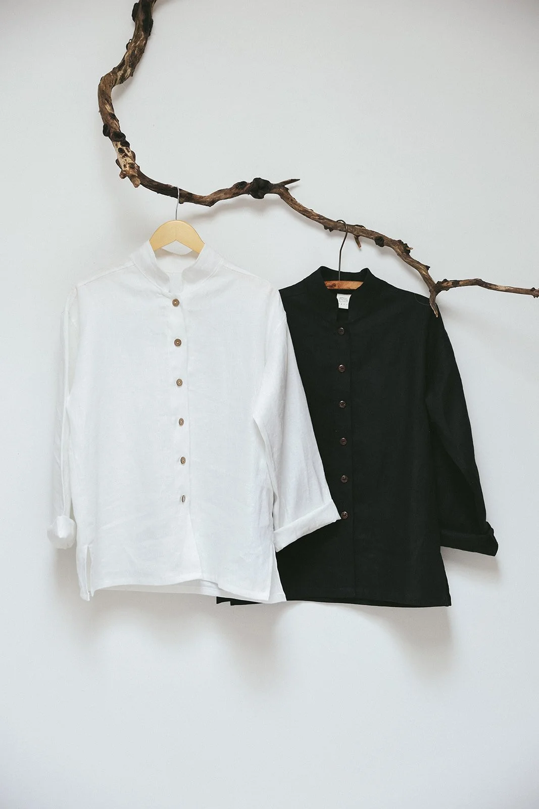 nomi-designs-linen-shirt-black-ivory-hang-on-branch.jpg