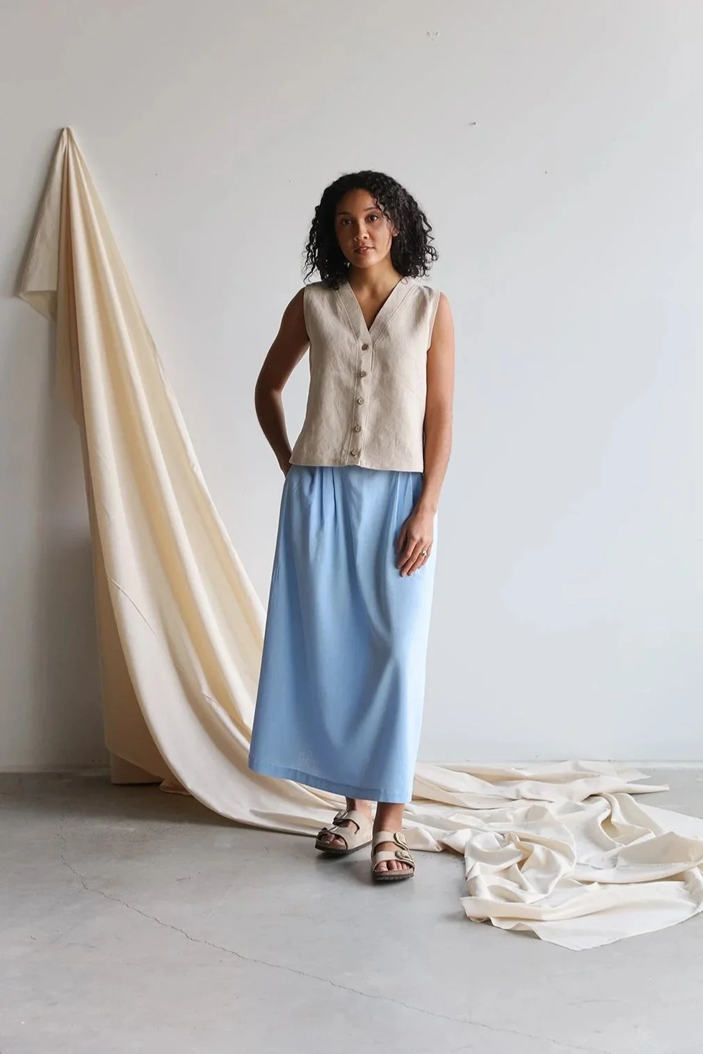 nomi-designs-linen-vest-natural-skirt-sky-front.jpg