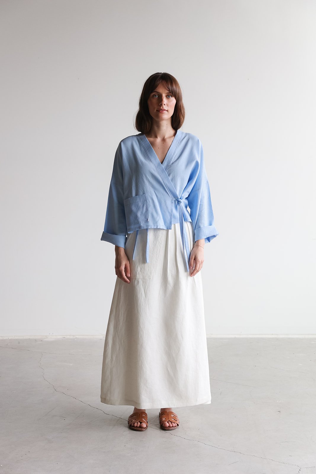 nomi-designs-linen-wrap-skirt-ivory-top-sky-front.jpg