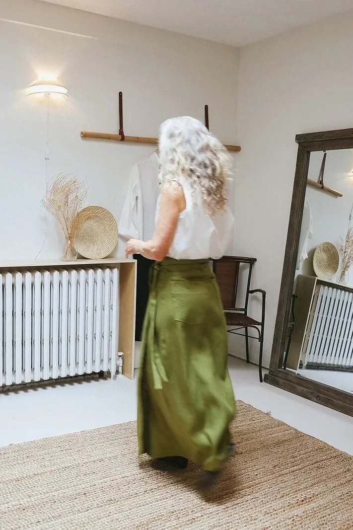 Nomi-designs-studio-linen-skirt-pesto-vest-ivory-walk.jpg