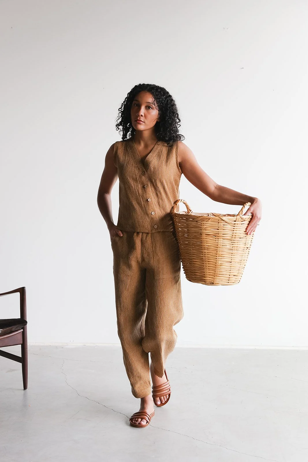 nomi-designs-linen-pants-vest-ginger-walking.jpg