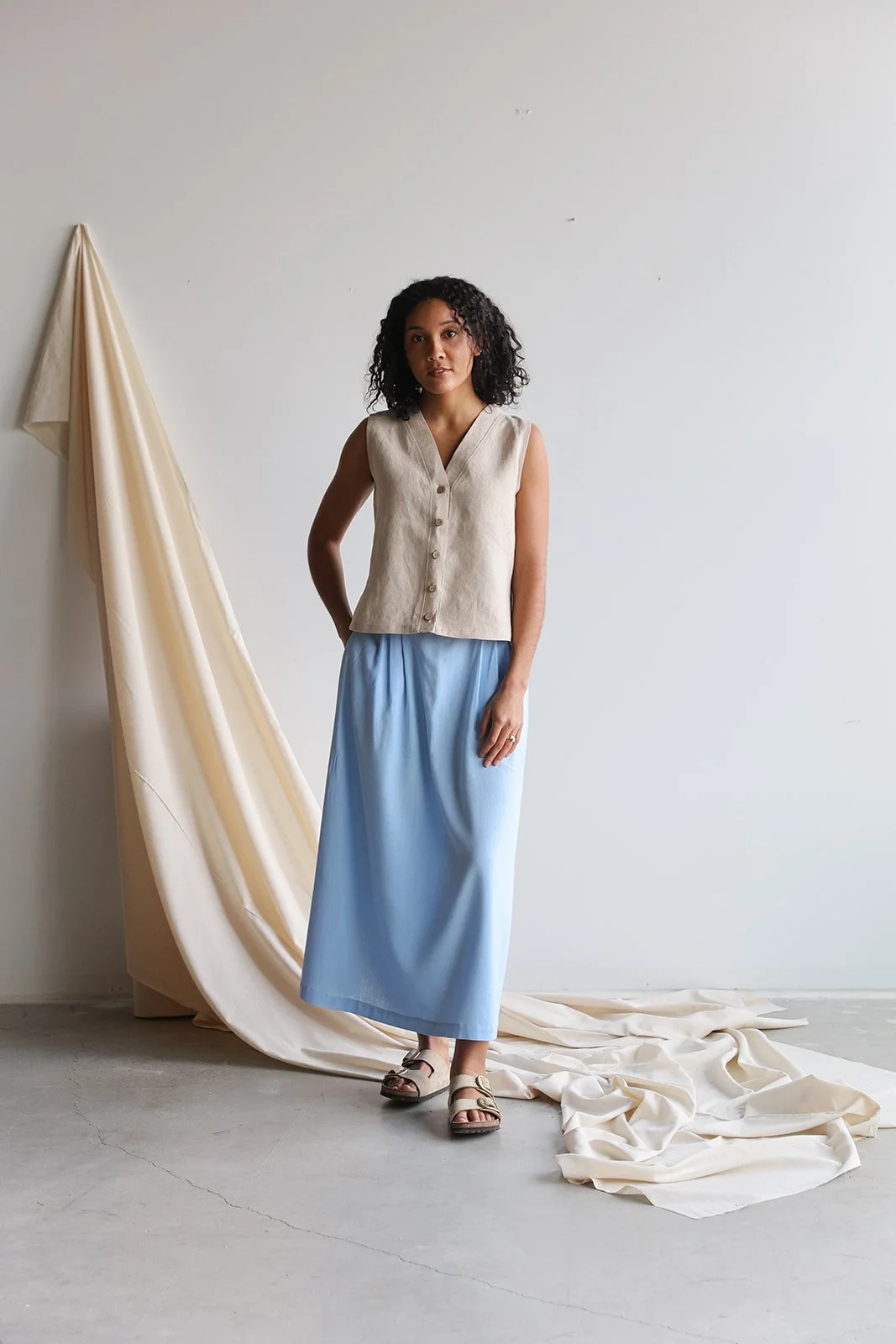 nomi-designs-linen-vest-natural-skirt-sky-front.jpg