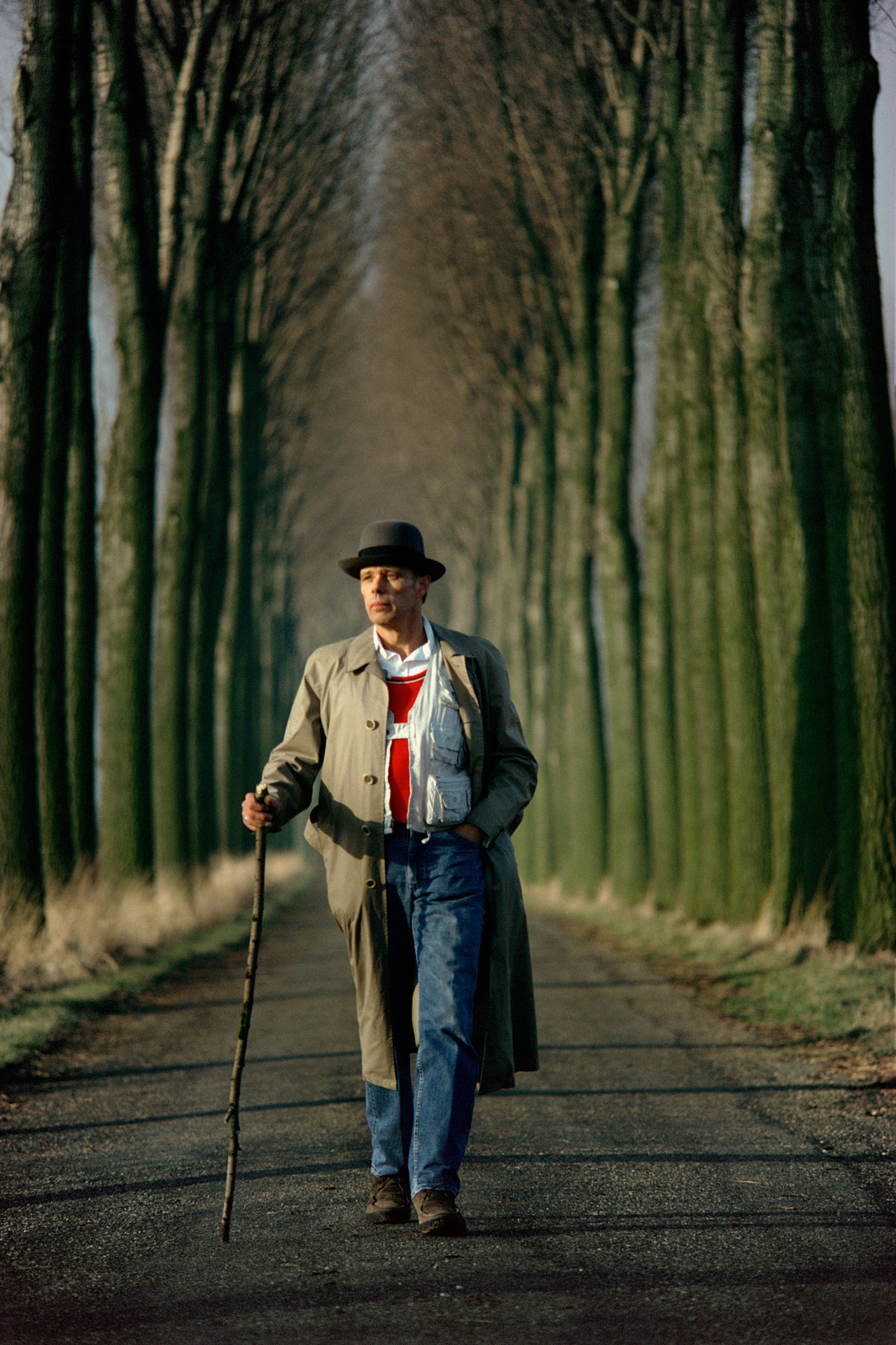  Joseph Beuys walks down an alley of poplar trees in the Düffel area 