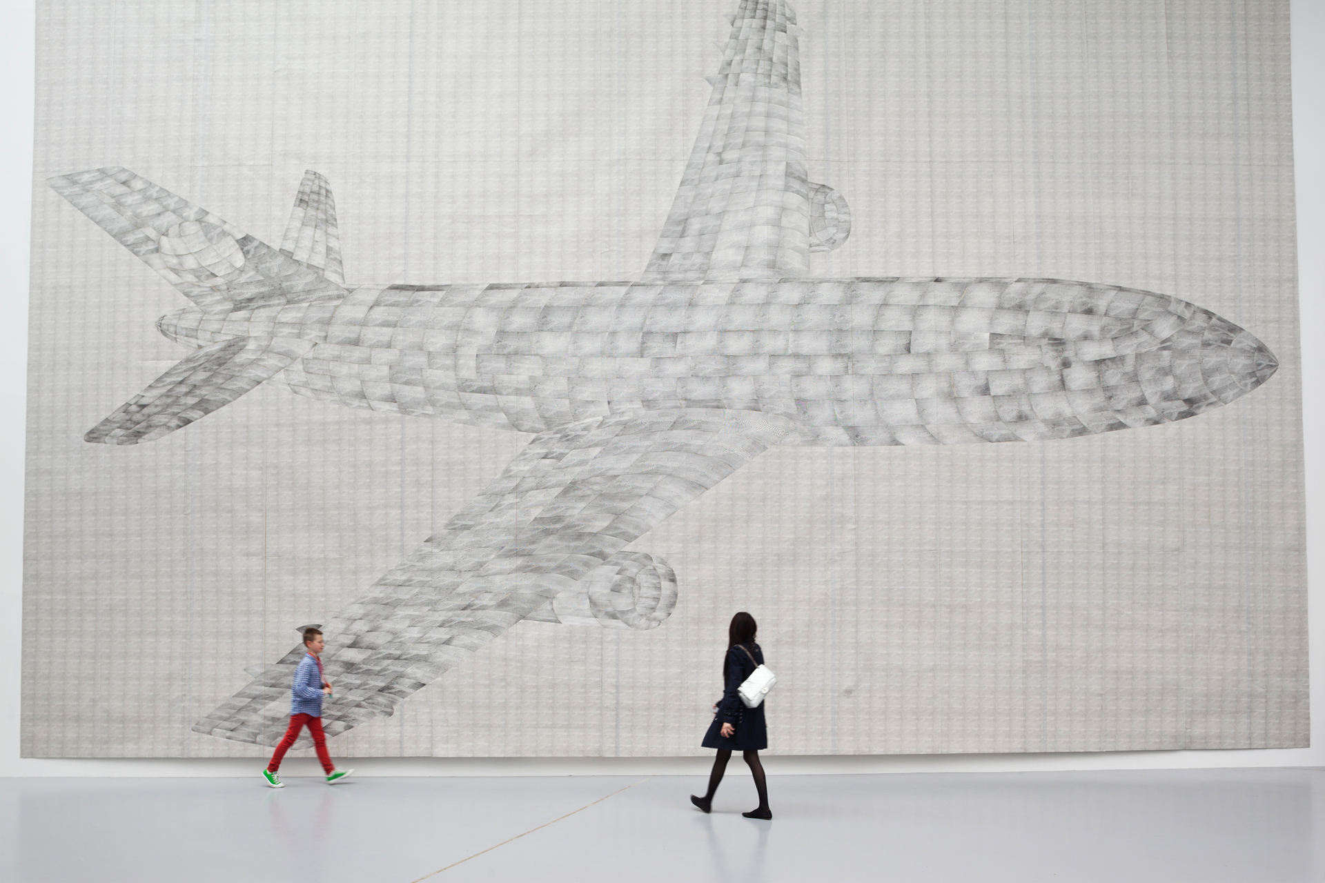  German artist Thomas Bayrle’s work is amongst the most impressive at dOCUMENTA(13). His huge collage made of thousand of photos depicts an airplane, but is surrounded by technical apparatuses such as car engines or windshield wipers in constant moti