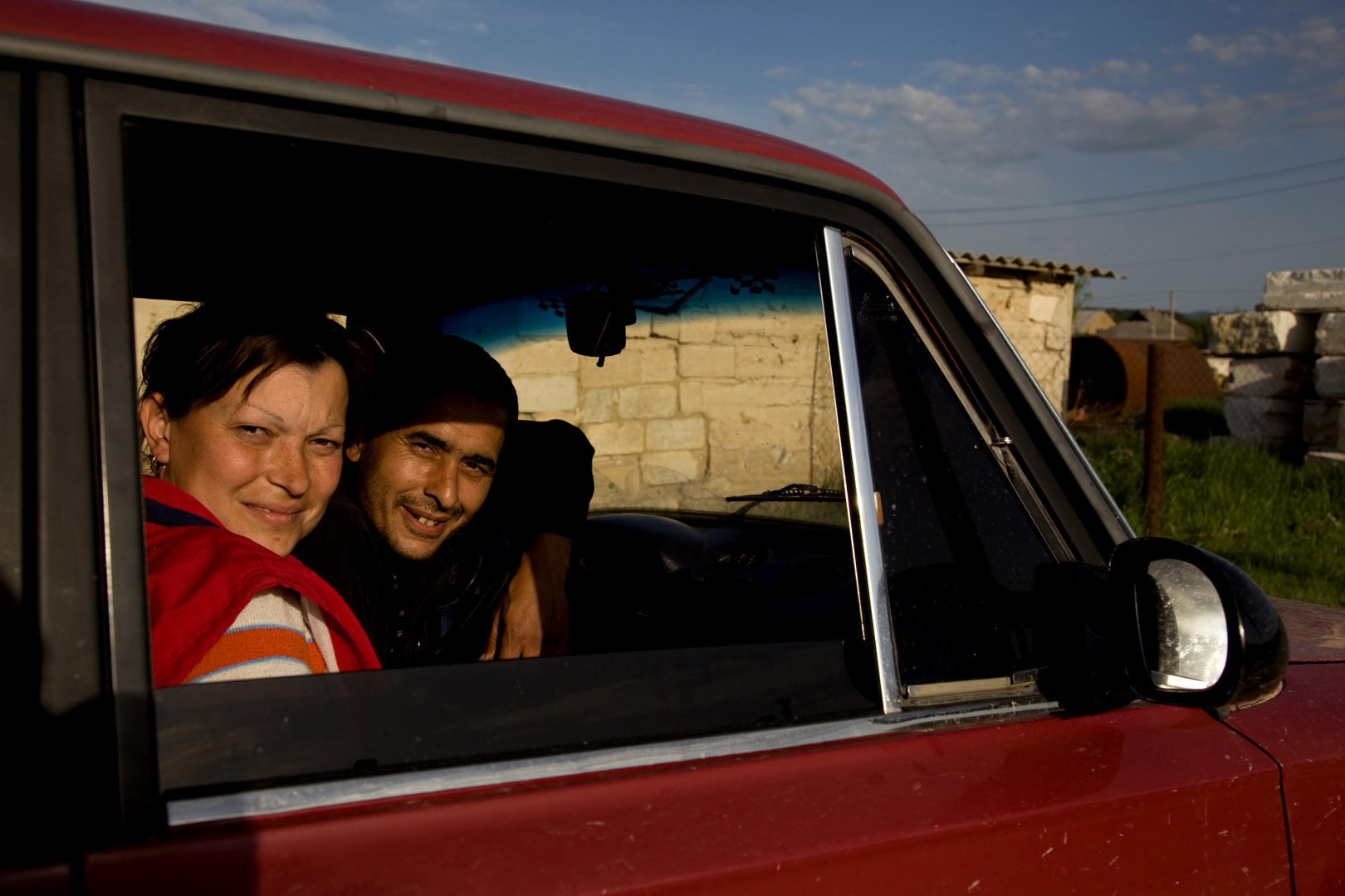  Behind this young Tatar couple are the new settlements in Sarysu, where the Tatar community has resorted to building temporary structures on state land in an attempt to reclaim ownership.  Sarysu, Crimea  