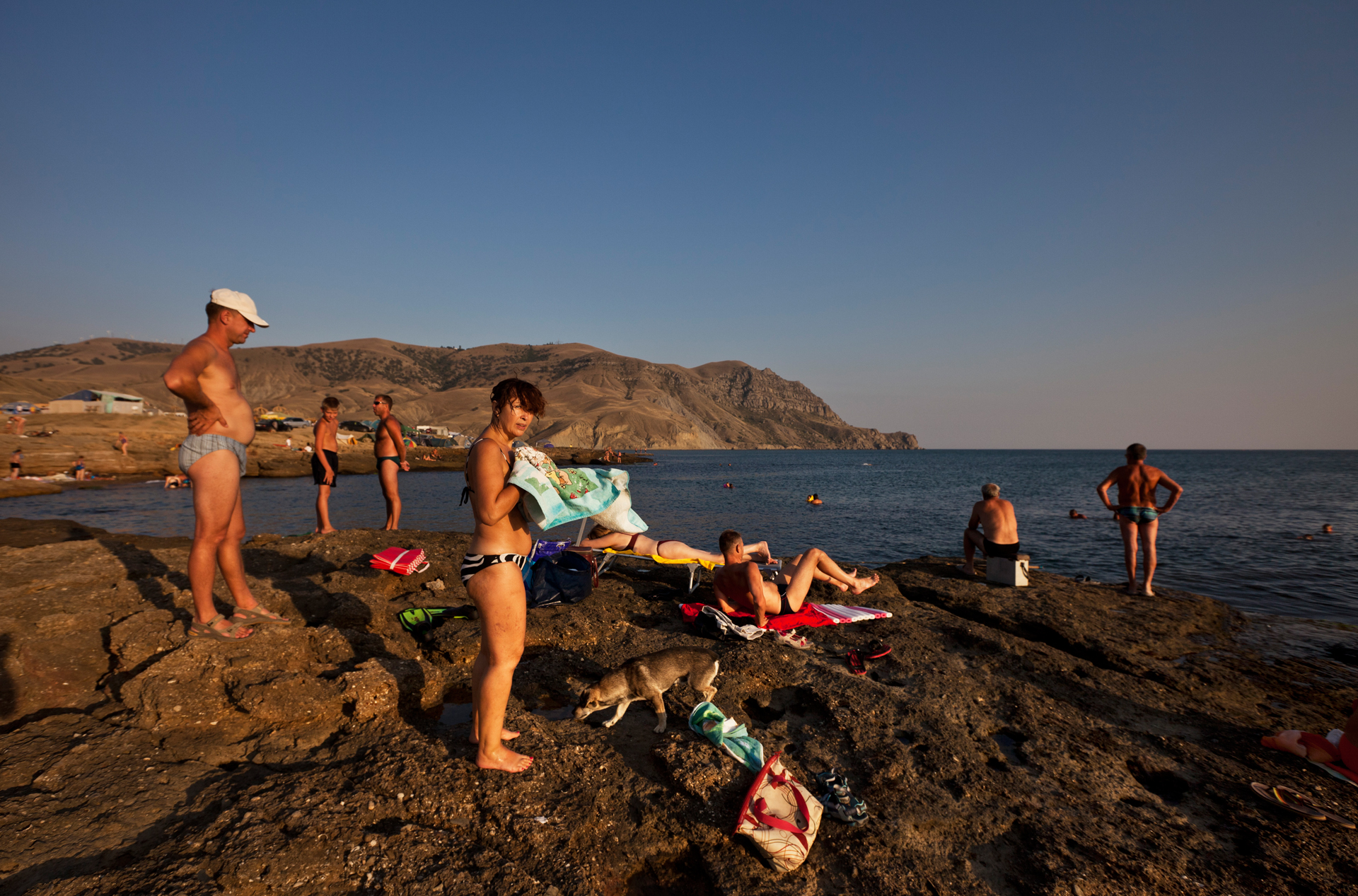  Tourists sunbathe and picnic at beach in Maganom, north of Sudak.  Meganom, Crimea  