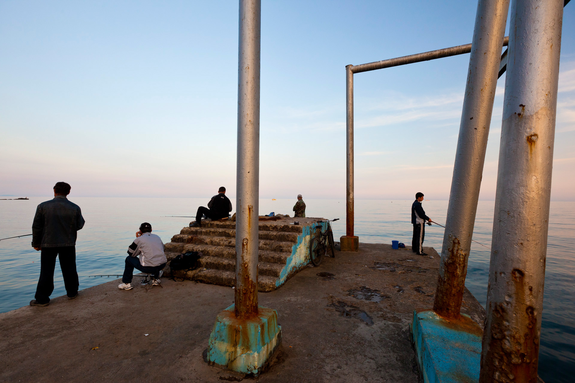  The lure of fishing leads to a jetty in Alushta. While tourism seeks a new identity on Crimea, many sites are still representative of its soviet past.  Alushta, Crimea  