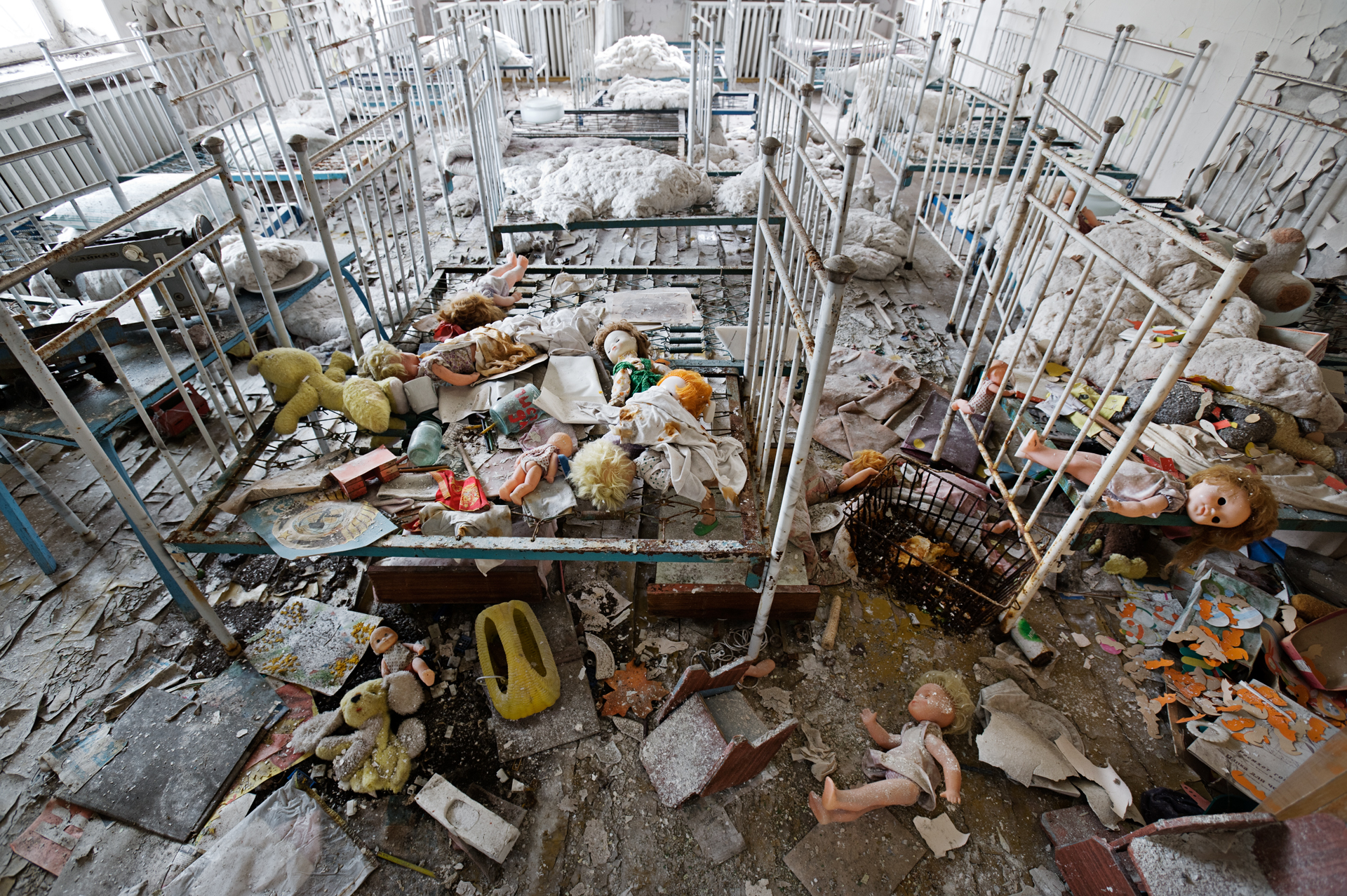  On the day of the disaster, children oblivious to the nuclear accident played in this Prypyat kindergarten, where dolls and toys still scattered on the floor are testament to their hasty departure.  Prypyat, Ukraine  