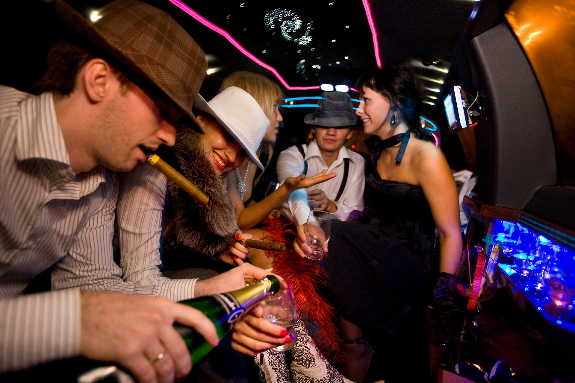  12:05AM - Members of Russia's new elite shop till they drop and party till dawn. This group of financial advisors has rented a white stretch limo to drink champagne and cruise the city. 