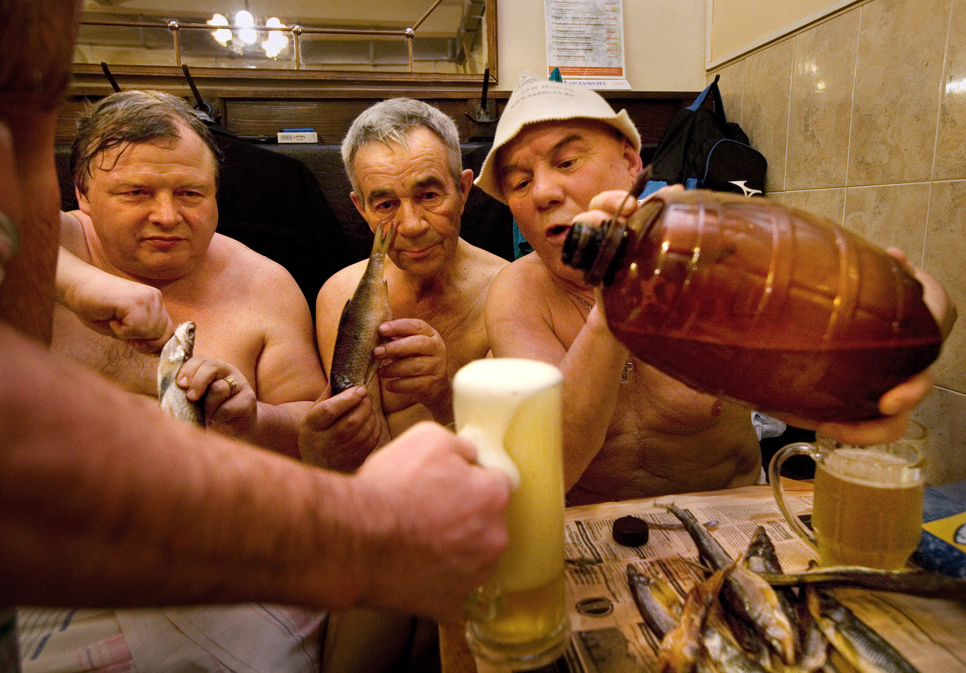  7:30PM - Friends Yevgeny, Anatoly, and Viktor polish off an evening with fistfuls of beer and smoked fish at the 200-year-old Sanduny baths, a traditional gathering place for the workaday crowd. 