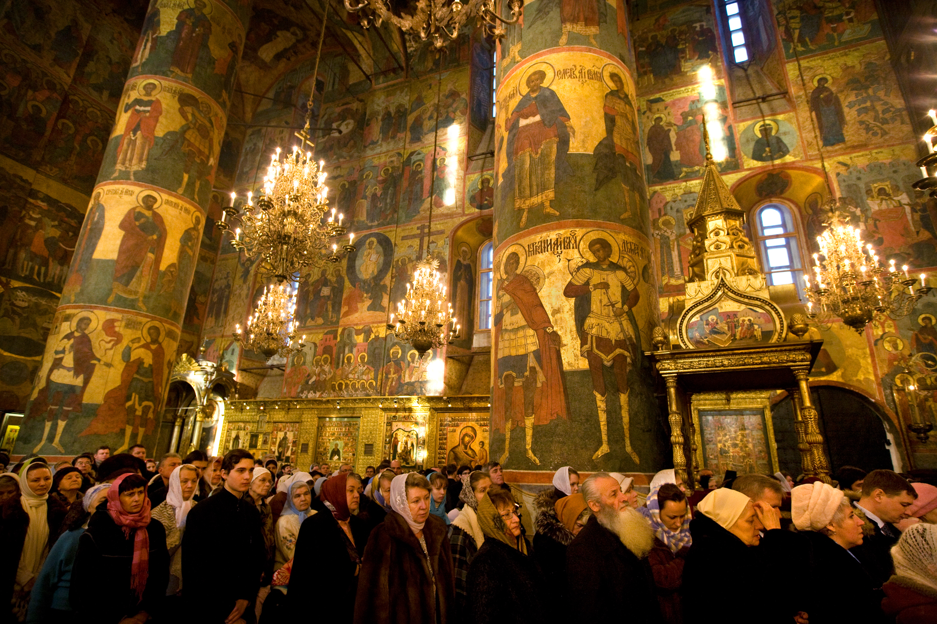  Resplendent icons of saints oversee Mass at the restored 15th-century Assumption Cathedral in the Kremlin.  Moscow, Russia  