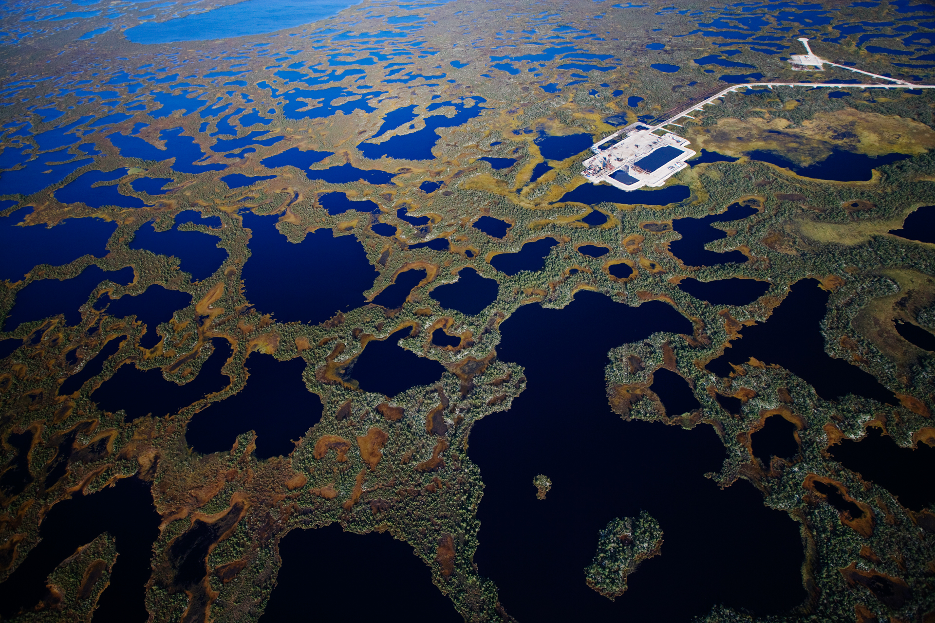  Near Kogalym, a LUKoil drill pad built atop fragile wetlands probes for new oil reserves.  Khanty-Mansiysk Region, Russia  
