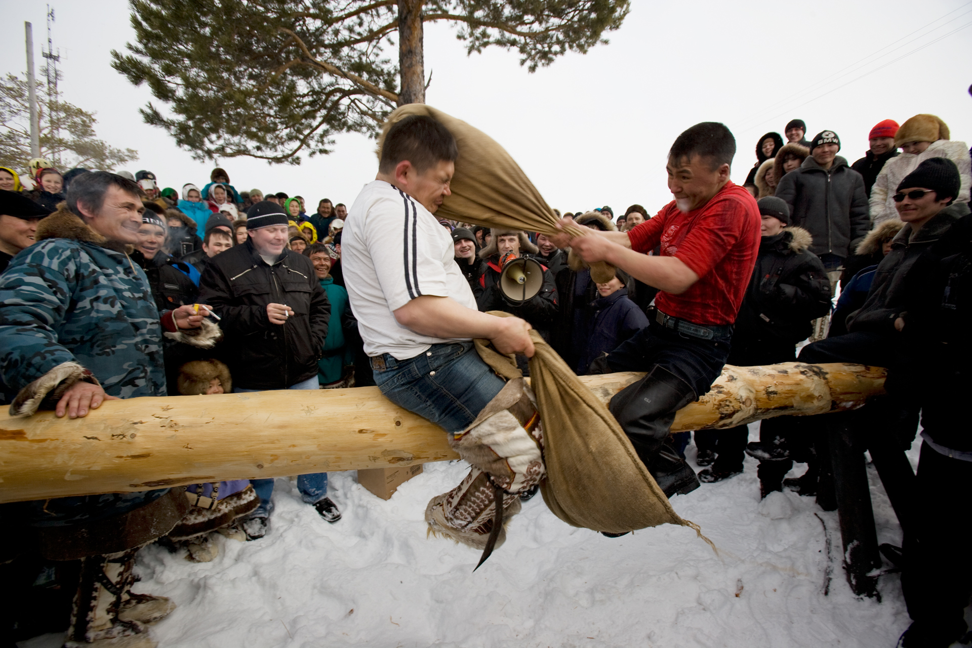 Traditional events and competitions during the Khanty-Mansiysk region’s annual “Fishing and Hunting Day” include the popular fight-on-a-log.  Russkinskaya, Russia  
