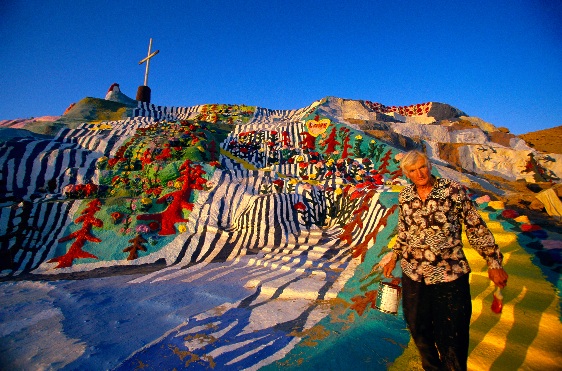  Leonard Knight, 71, has redesigned the desert landscape with adobe, straw, and thousands of gallons of paint. "Salvation Mountain" is now a national folk art shrine.  Niland  