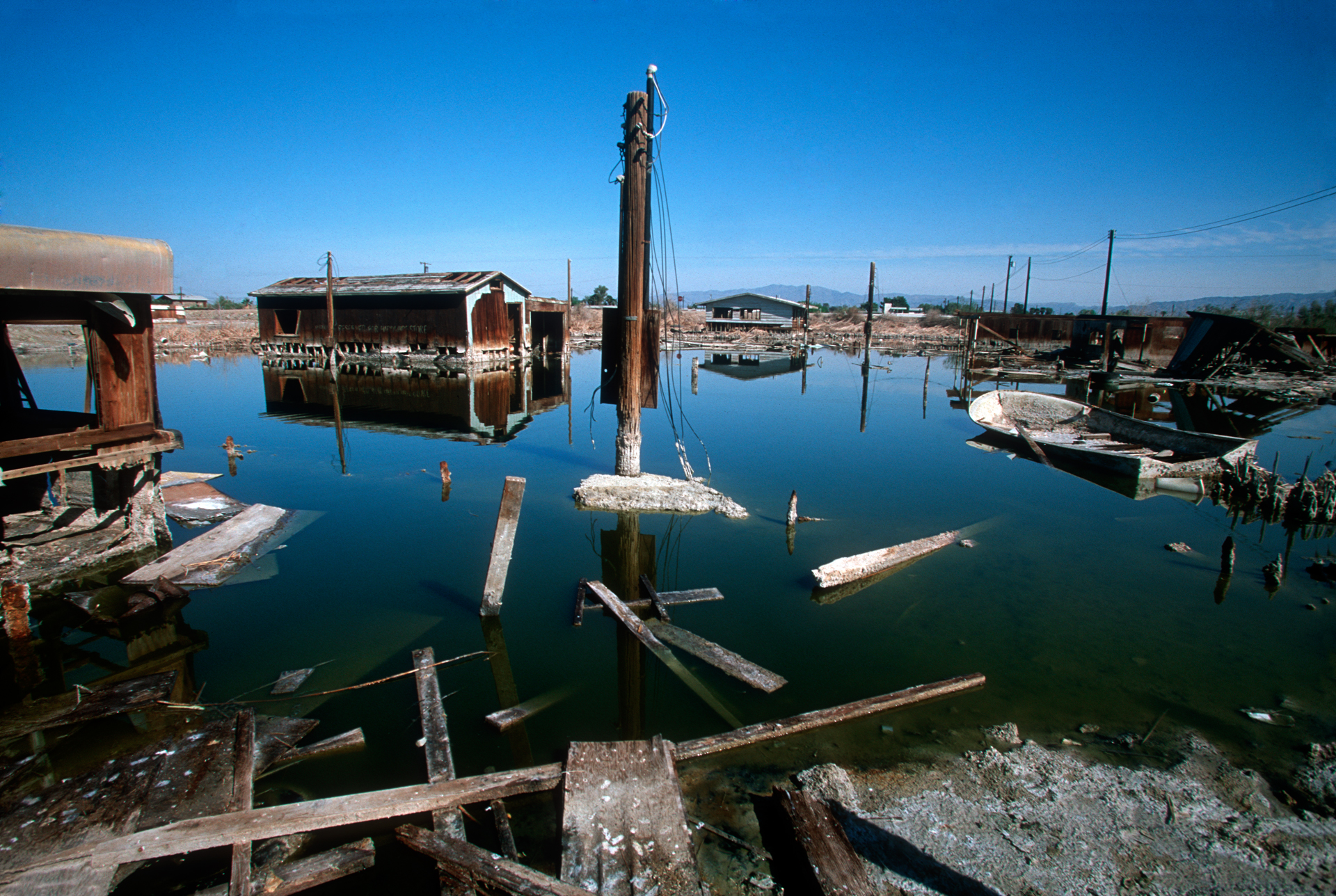  The fluctuation in sea level has flooded abandoned homes, leaving them to rot in the salt encrusted water.  Bombay Beach 