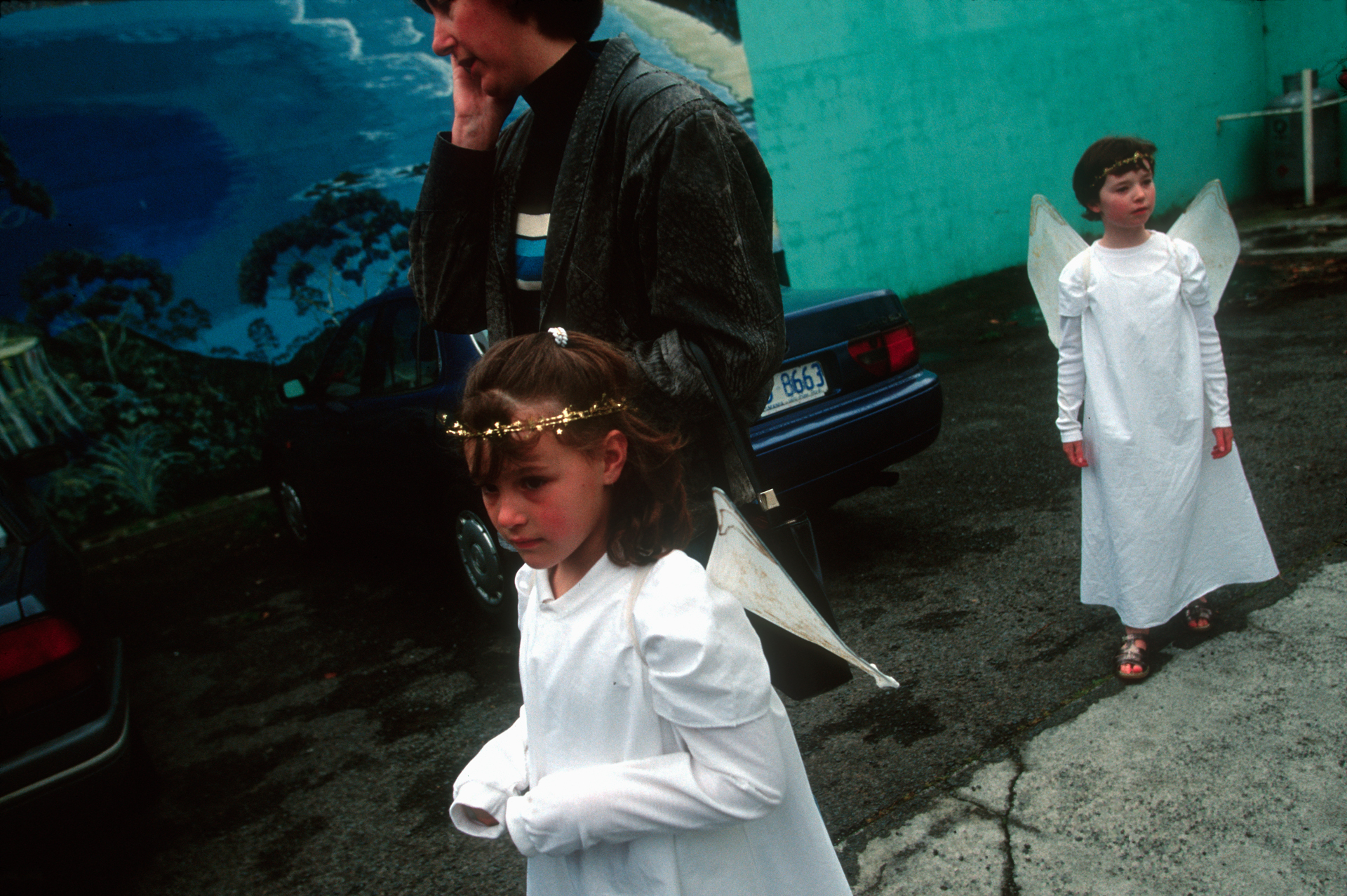  Two young girls dressed as angels are escorted by their mother to the Hobart annual Christmas Parade that kicks off the Christmas season in Tasmania.  Hobart  