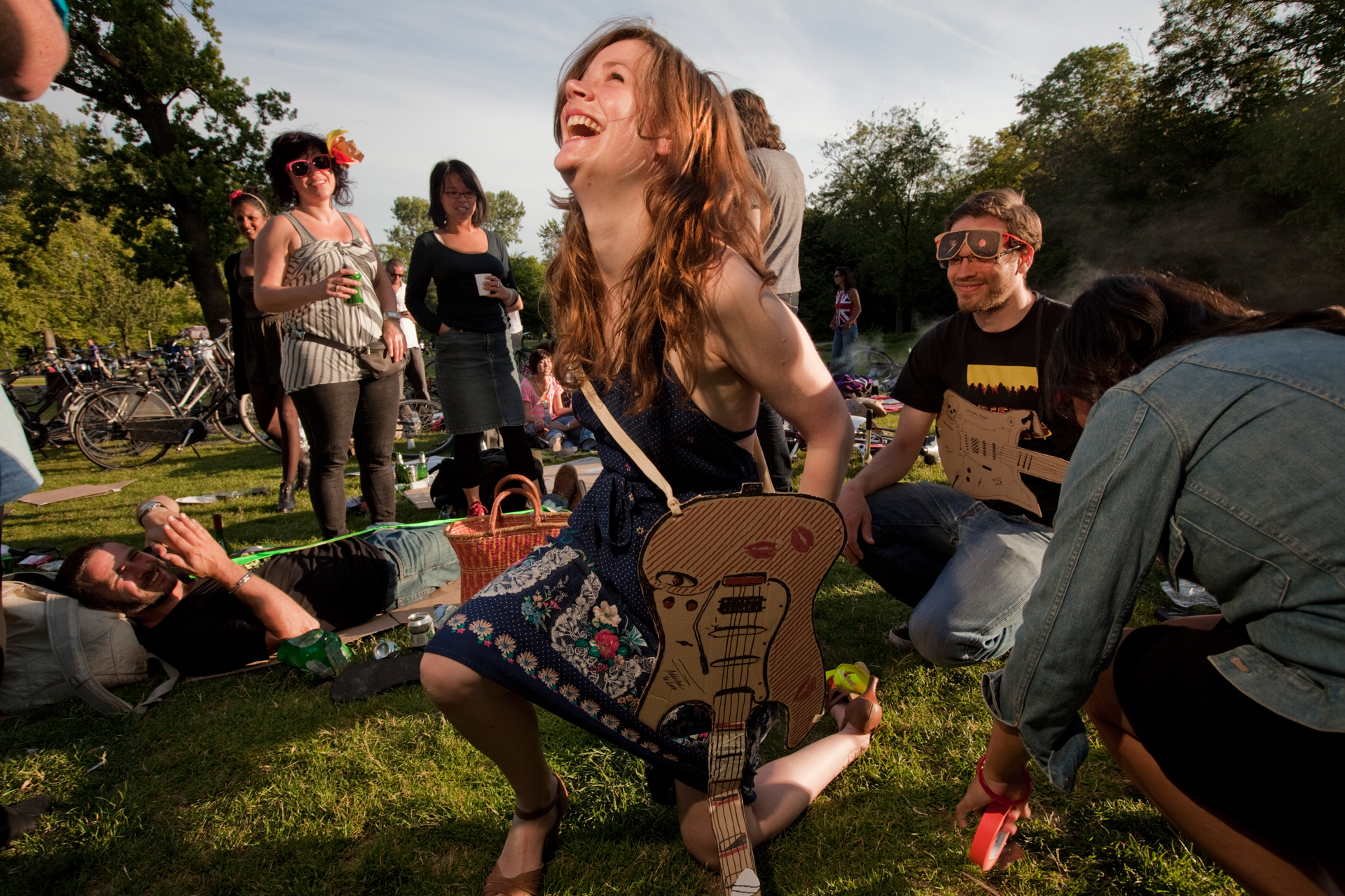  Young friends gather to relax and enjoy the sun at Vondelpar in Amsterdam. 