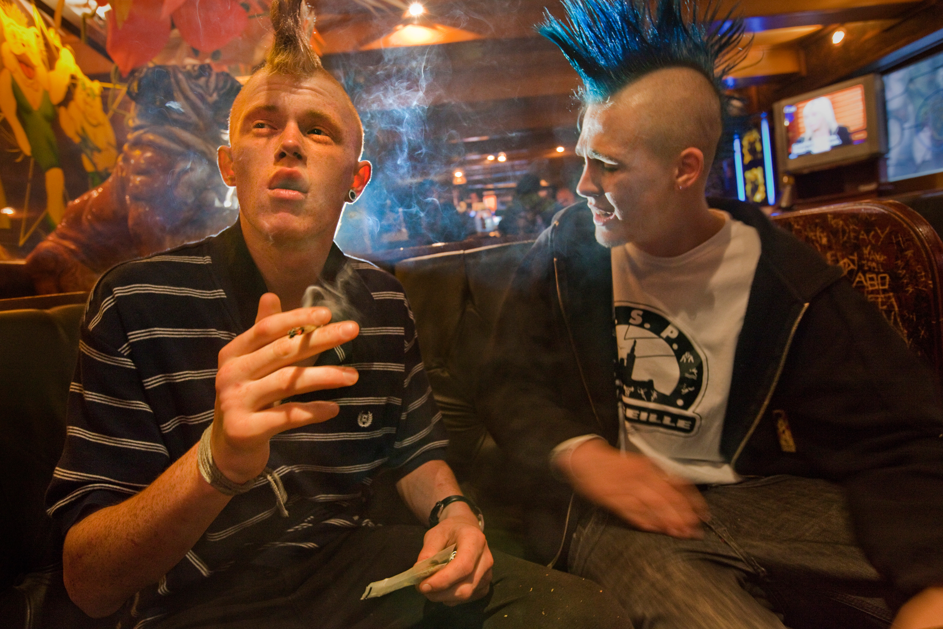  Sporting Mohawks, two customers enjoy hash at The Bulldog, a famous cannabis-selling coffee shop in Amsterdam’s Red Light District. 