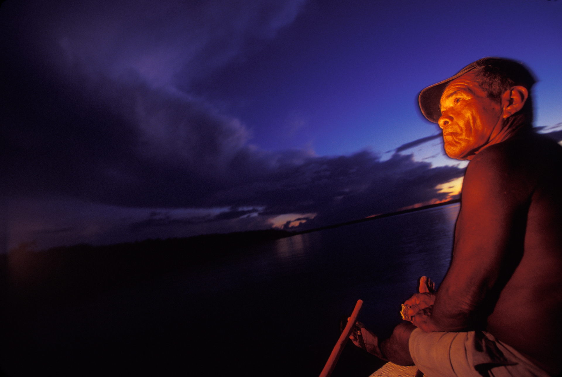  Watching the moonrise from a boat on the Rio Canuma near Niteroi in Kwata-Laranjal.  Niteroi, Brazil  