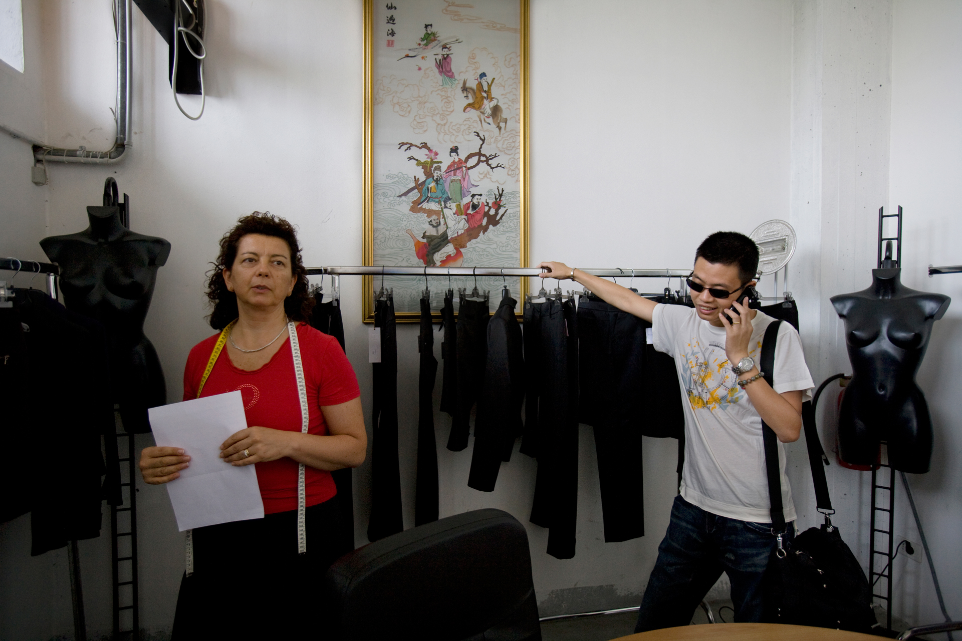  Petro, born Hu Bing Laing, makes his morning rounds among some of the businesses his family manages, including a clothing design studio, where mostly Italian employees produce showroom pieces, often "inspired" by popular high-end designers. 