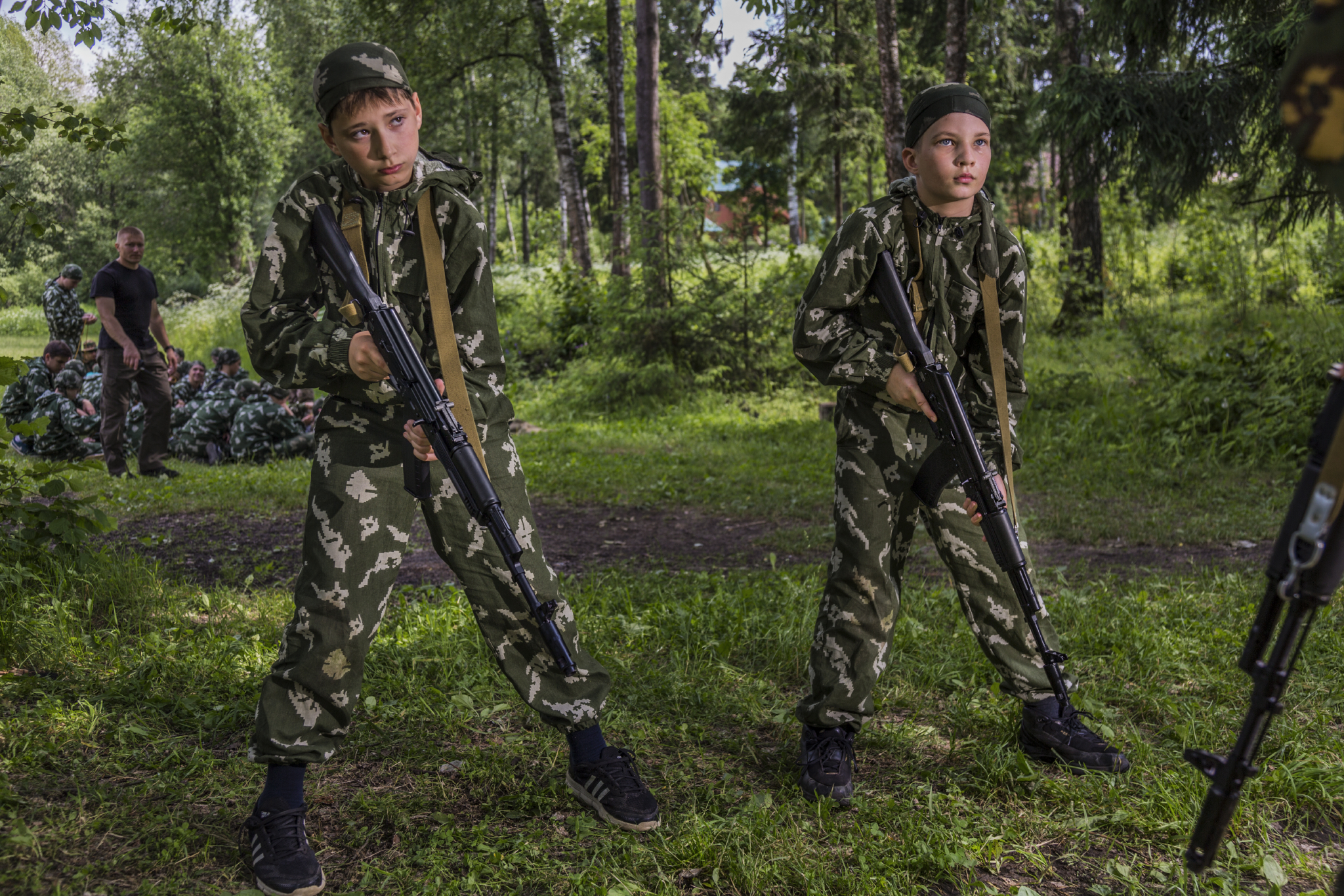  At a sports and military camp, paratroopers teach children as young as 10 years old how to handle weapons. Putin has tried to restore Russian pride in the country's military by defeating rebels in Chechnya, seizing Crimea, invading Ukraine, and inte