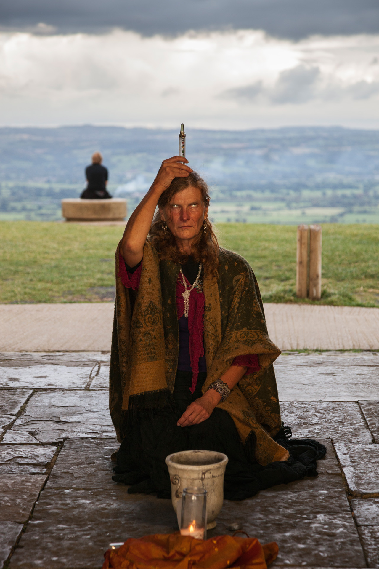  A woman performs a ritual inside the bell tower on Glastonbury Tor, believed to be the mythical entrance to Avalon, the land of fairies. For centuries, people in Glastonbury believe the legendary island of Avalon to be the final refuge for the wound