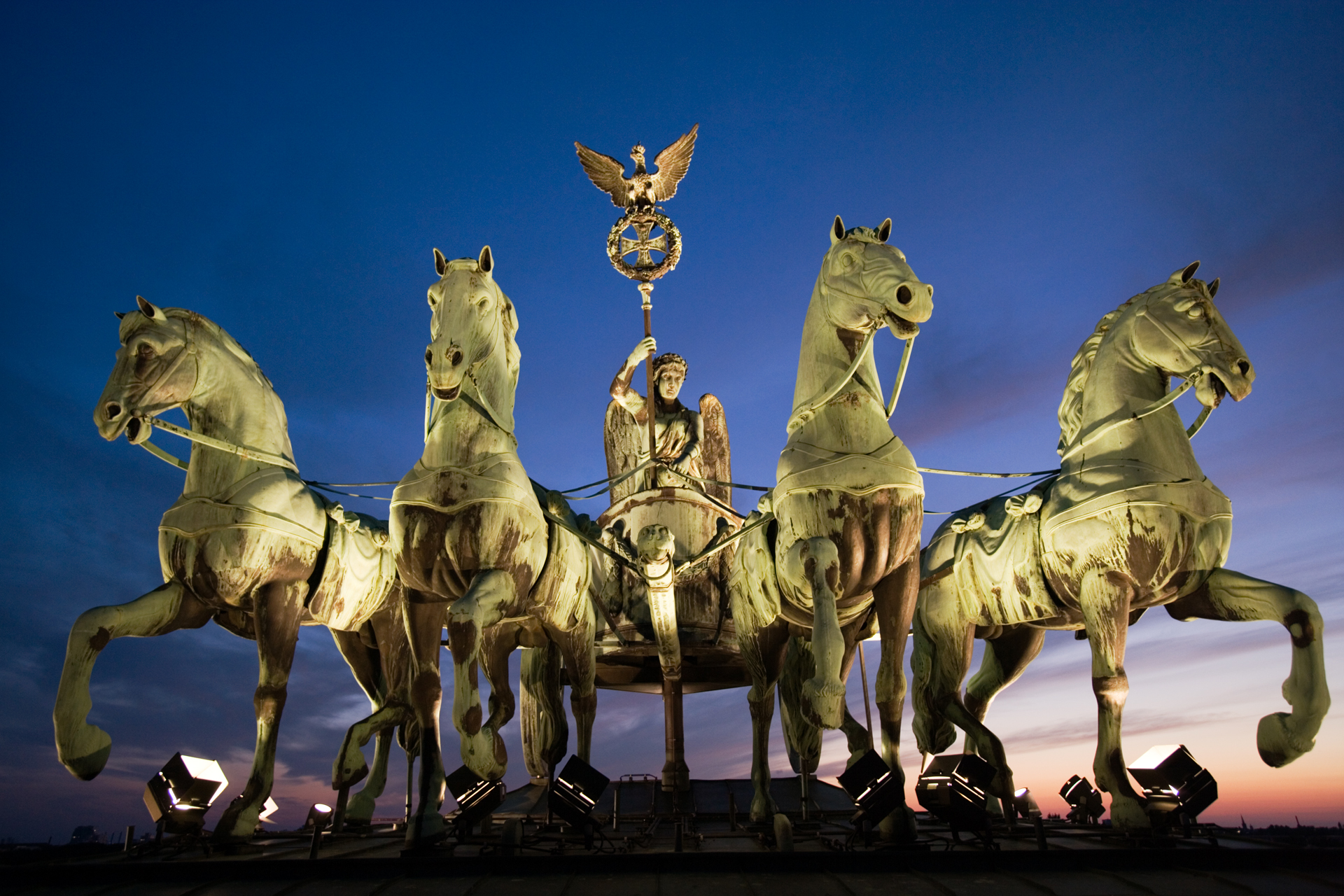  The Quadriga crowns the Brandenburg Gate, Berlin’s trademark triumphal arch. The four-horse chariot was looted by Napoleon in 1806 but returned after his defeat in the Battle of the Nations.  Berlin, Germany  
