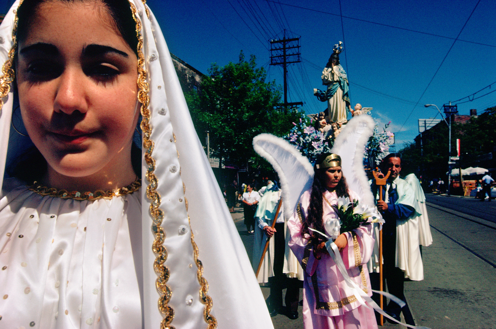  Children of Portuguese immigrants reaffirm spiritual ties to their parents’ homeland at the feast of Senor de Petra, which honors the suffering of Christ. 