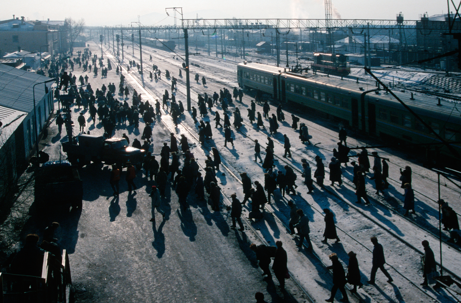  Travelers pass through a busy cargo terminal at the Ulan Ude Station.  Ulan Ude, Russia  