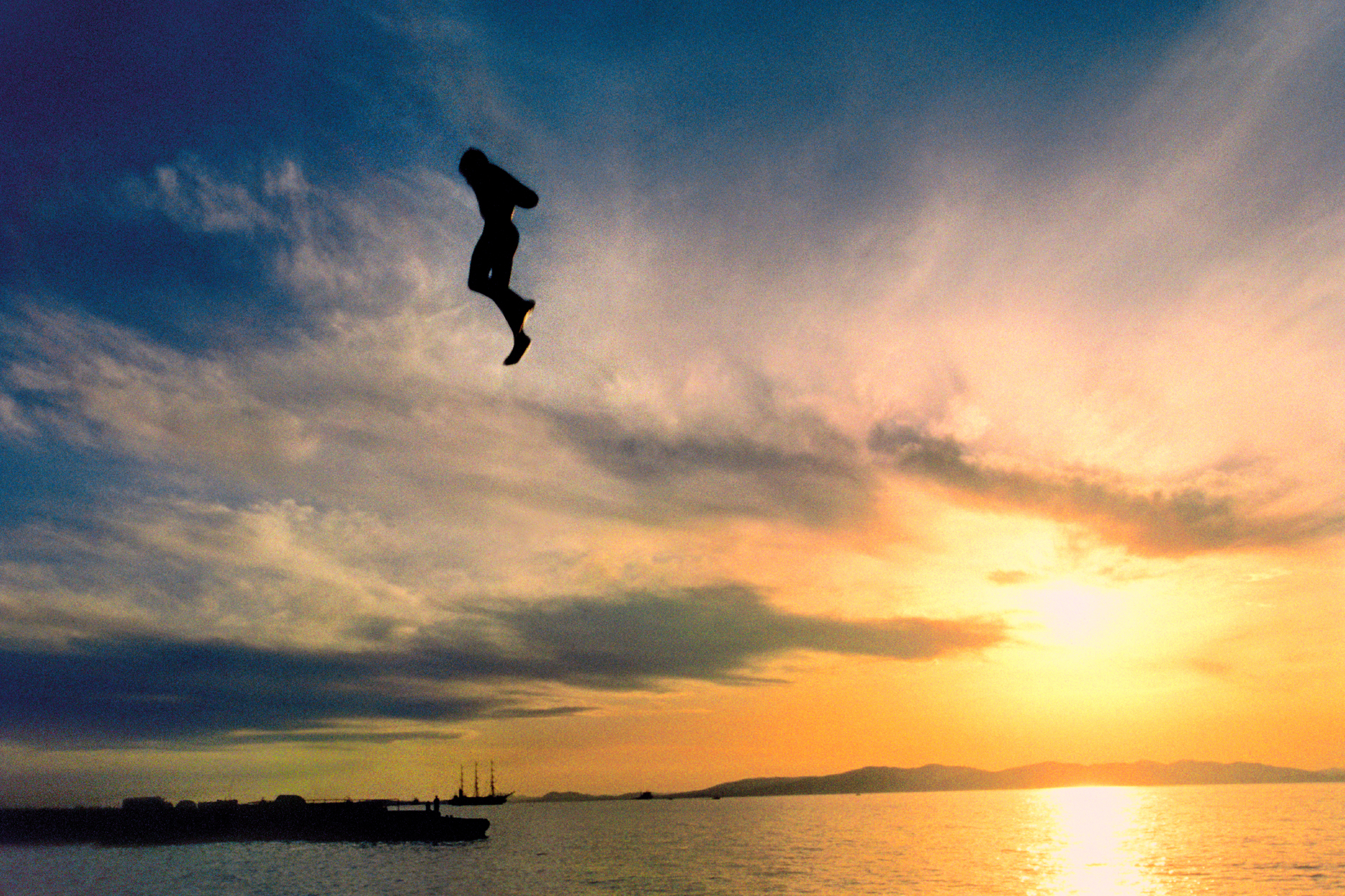  A swimmer jumps into the Sea of Japan in Vladivostok, a Russian traditional summer vacation spot.  Vladivostock, Russia  