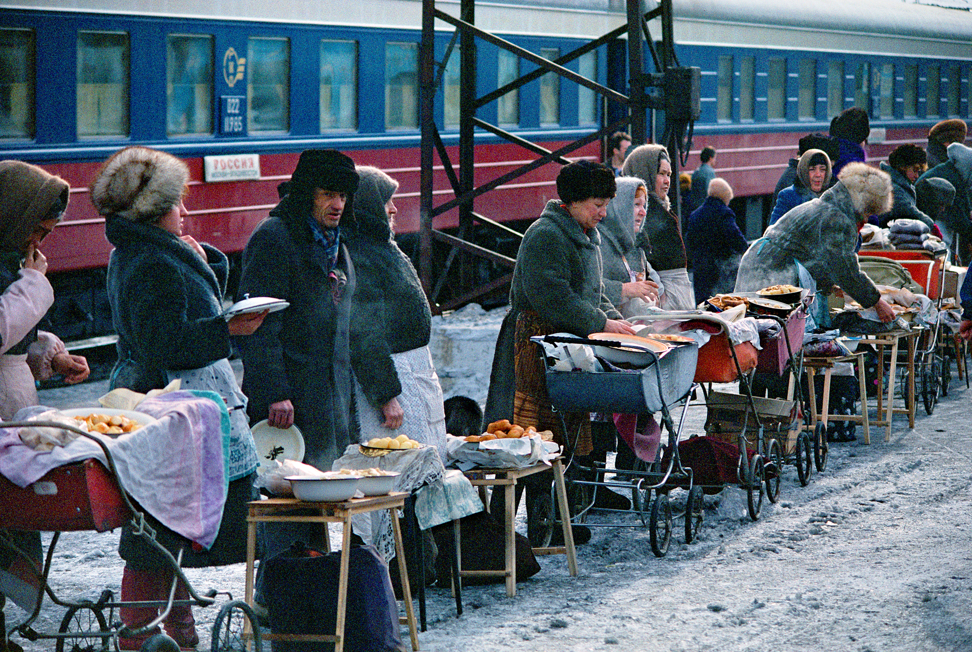  Babushkas load baby carriages with pans of home-cooked food and garden produce to sell at Petrovskiy Zavod. Many struggle to supplement government pensions worth only about $60 a month.  Petrovskiy Zavod, Russia  