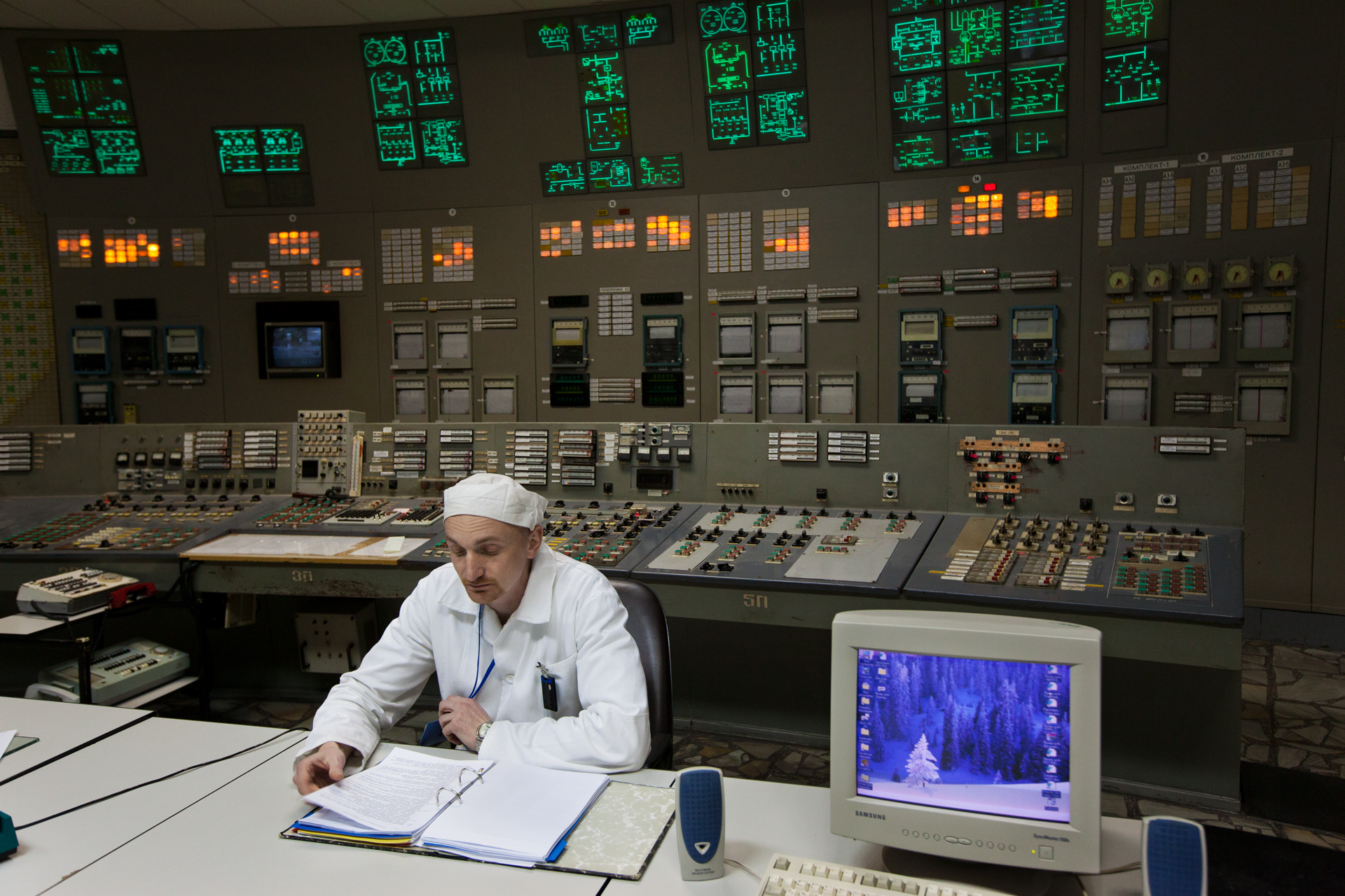  An engineer maintains the safety systems in the control room of reactor #3, identical to the one of reactor #4 where the fatal mistake occurred in 1986.  Chernobyl Nuclear Power Plant, Ukraine  