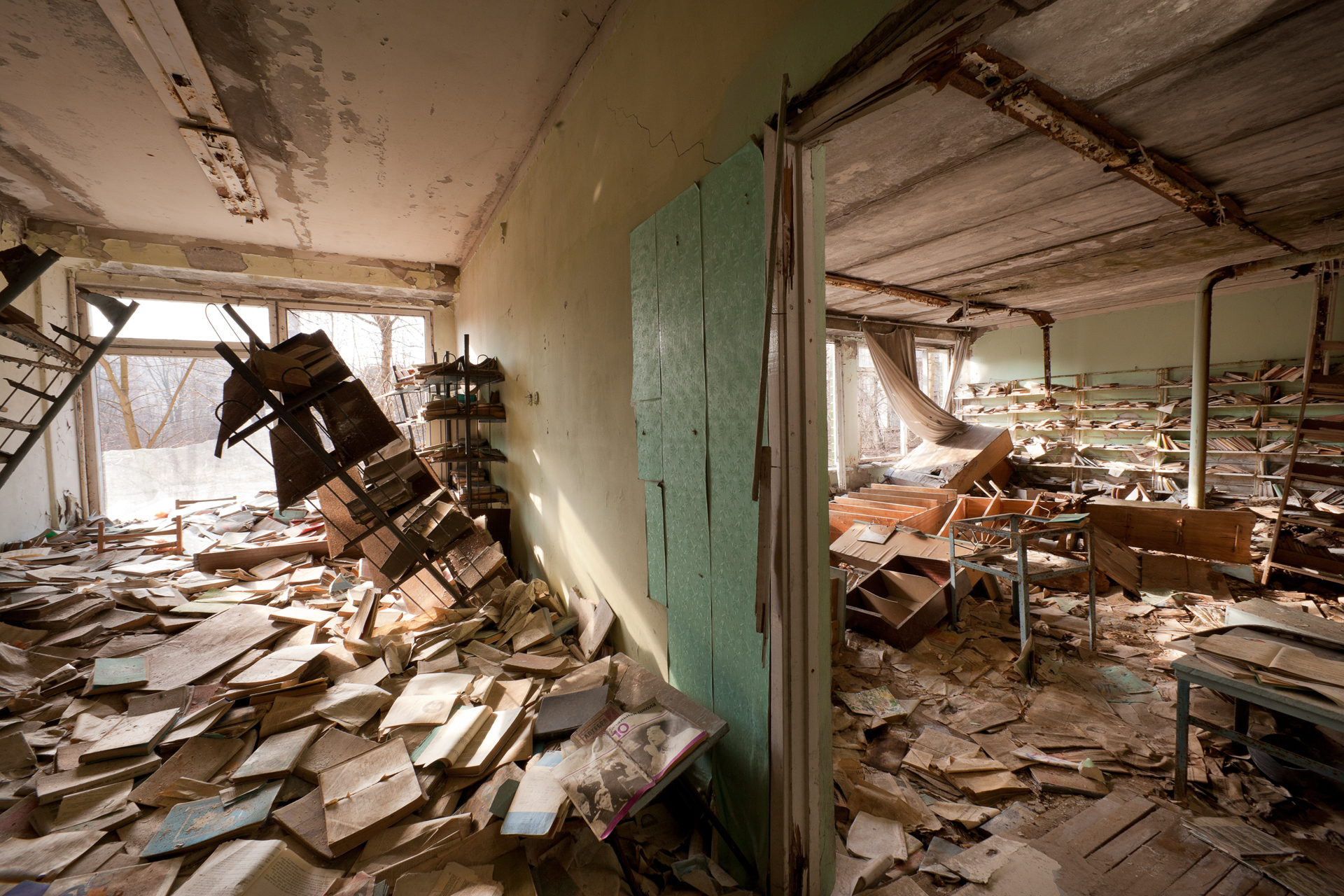  Books rot and paint peels in a school library.  Pripyat, Ukraine  