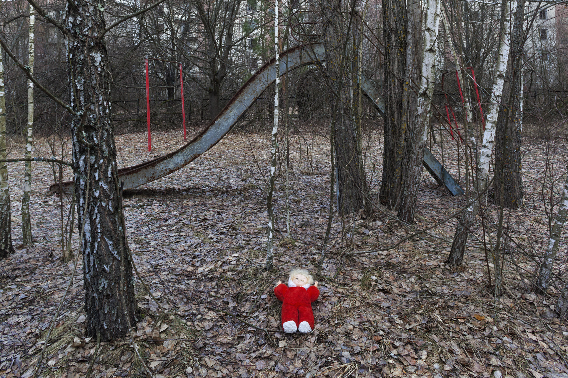  The abandoned, lonely doll, neatly arranged, has become a standard tourist motif and an obvious indication that visitors were here.  Pripyat, Ukraine  