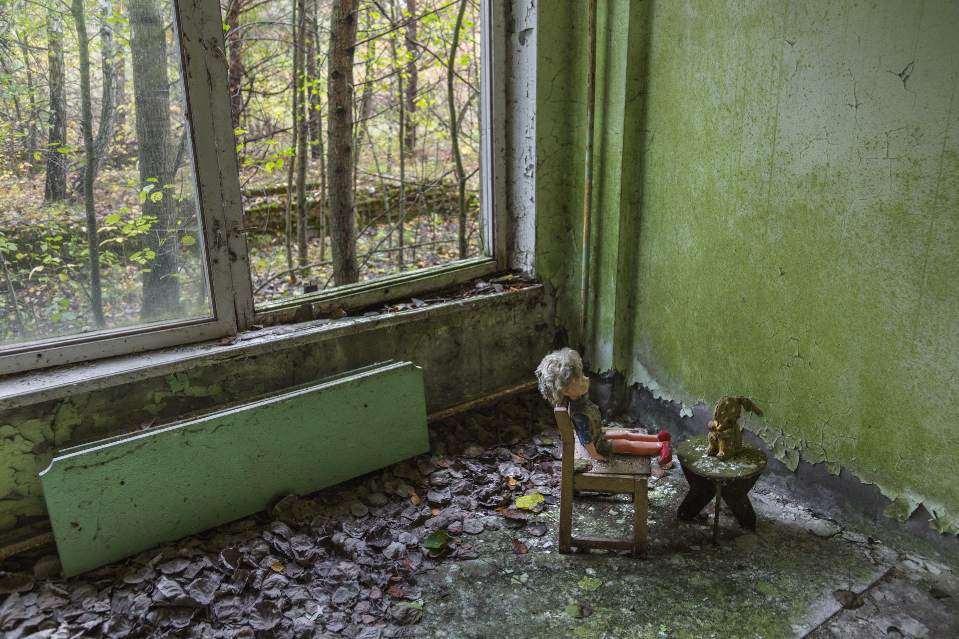  In an abandoned kindergarten children's toys and gas masks create a strange still life. One can suspect that the mix was created intentionally.  Pripyat, Ukraine  