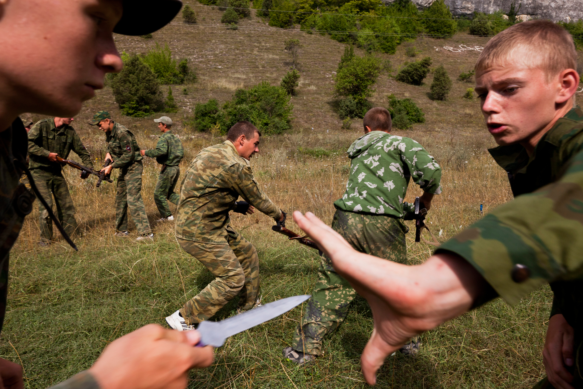  Practicing an ambush, children learn to defend themselves against an enemy using knifes.  Eski-Kermen Region, Crimea  