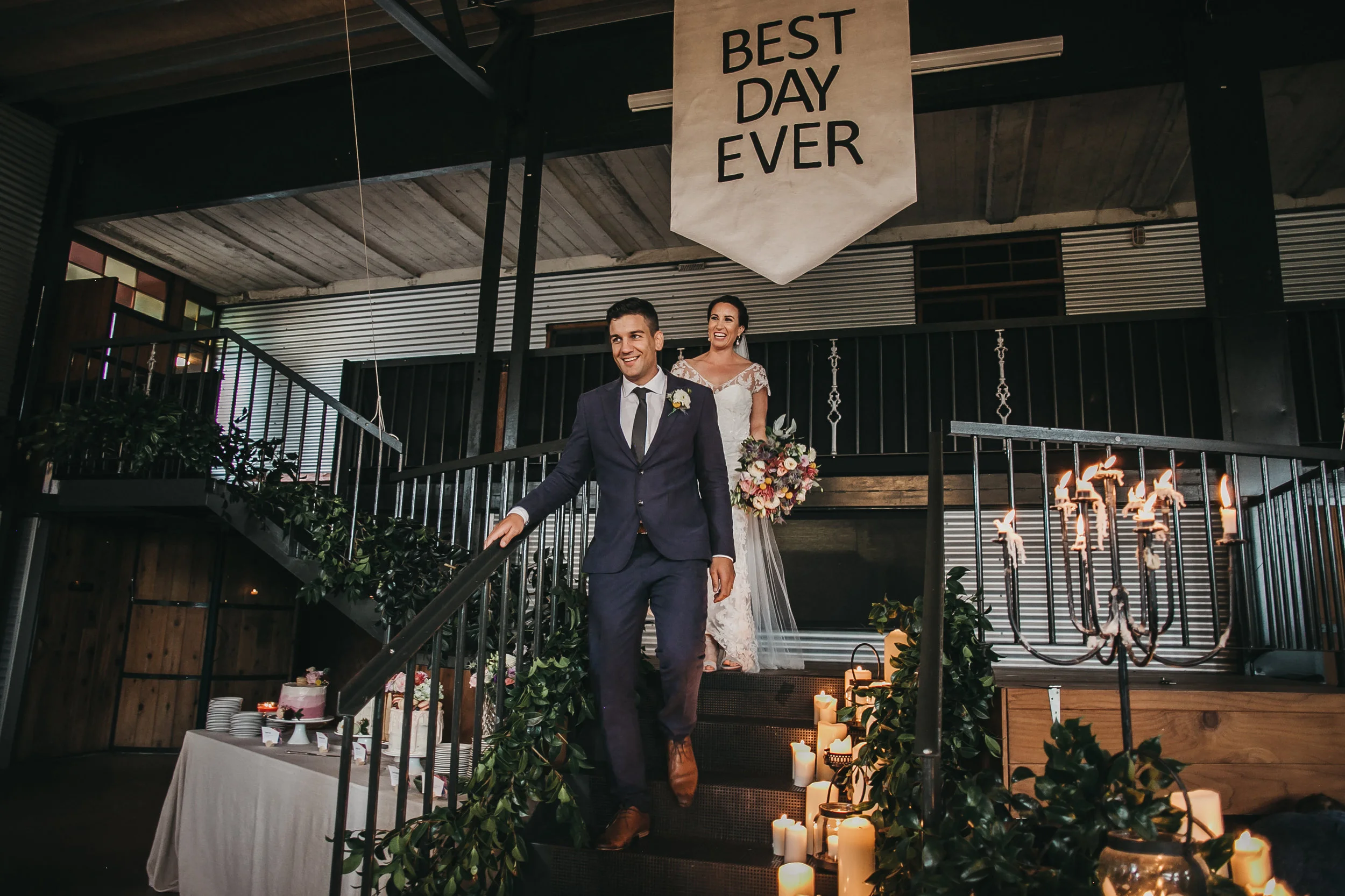 Aimie and Ryan entering into their reception captured by Nita Meyer